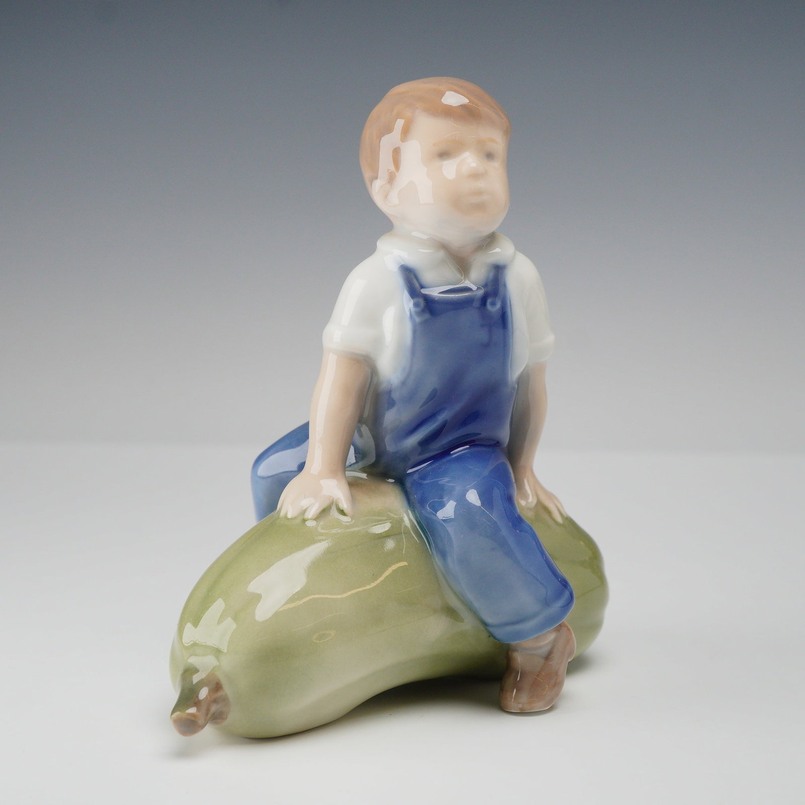 Royal Copenhagen Porcelain Figurine, Boy on Gourd 4539 (1 of 3)