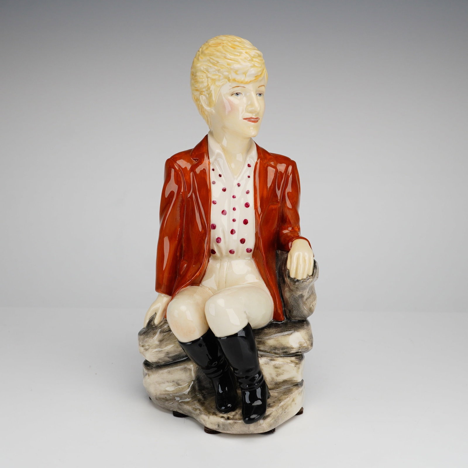 Kevin Francis Ceramics Limited Edition Character Jug, Princess Diana: A glazed ceramic character jug or small teapot depicting Princess Diana, produced by Kevin Francis Ceramics of Staffordshire, England. The figure is portrayed in equestrian attire, seated on a rocky
