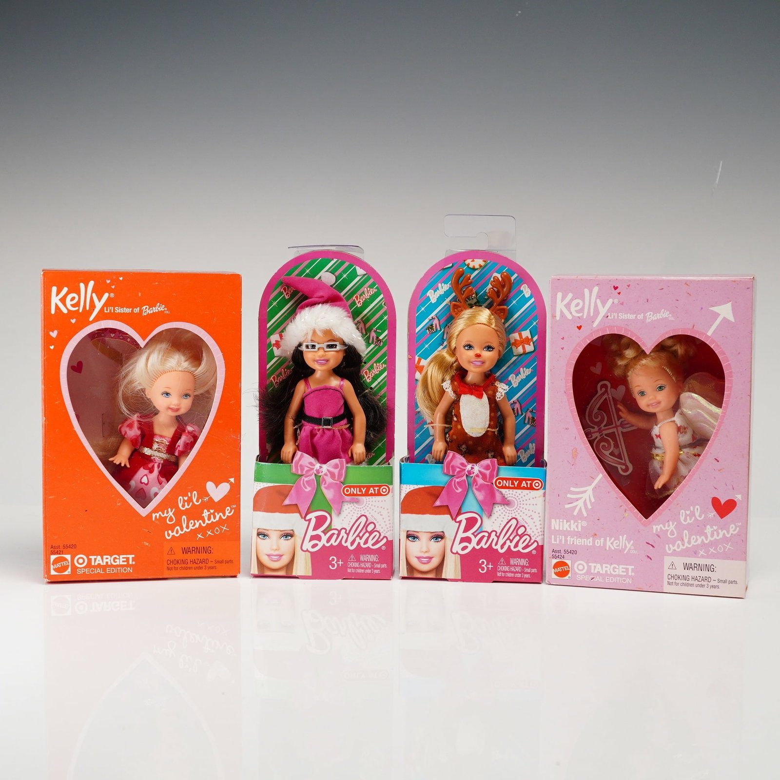 Mattel Kelly and Barbie Target Special Edition Holiday Dolls, 4 Inches: Produced by Mattel, this lot features four vinyl dolls released as Target Special Editions. The collection includes two My Li'l Valentine dolls: Kelly with rooted blonde hair in a red and pink dress