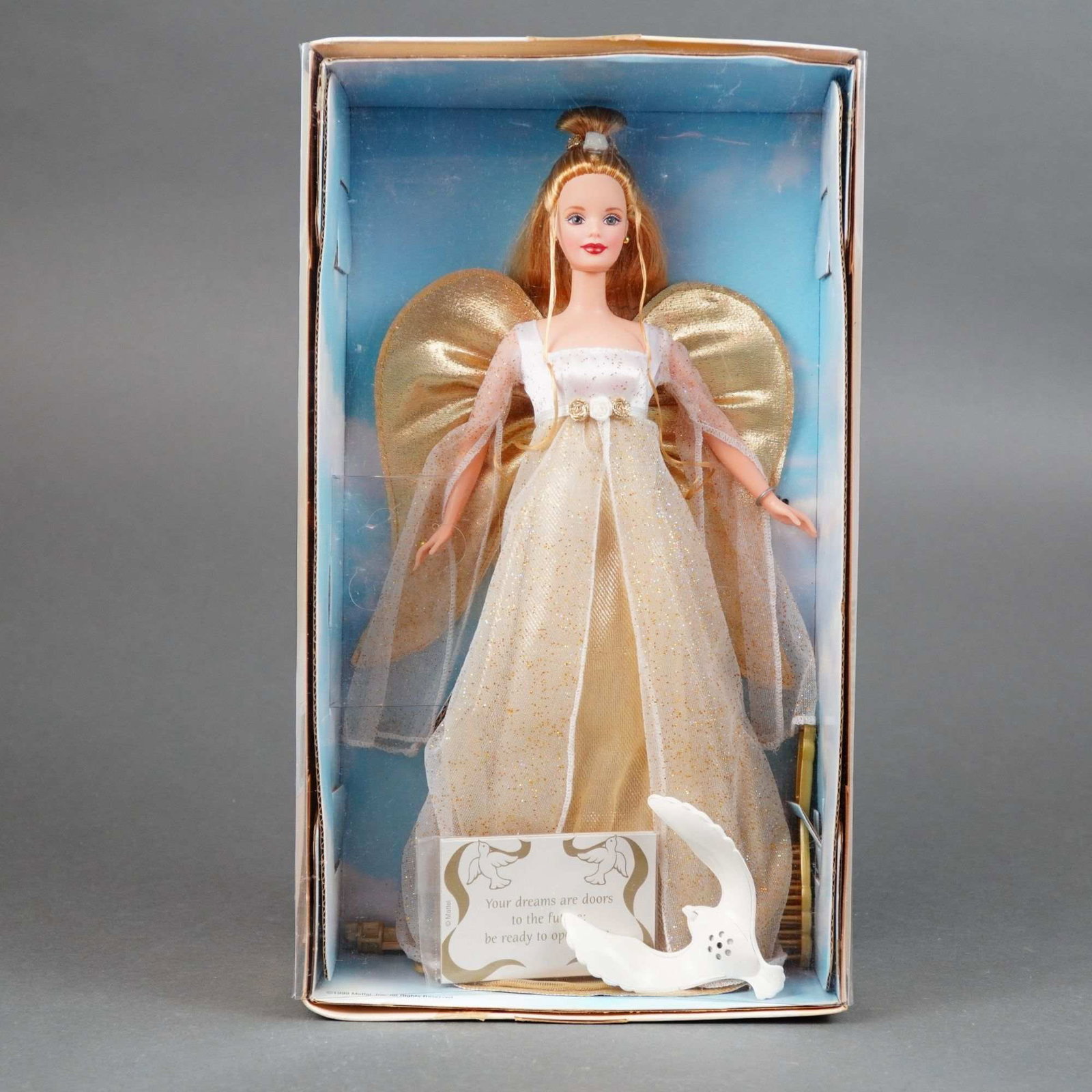 Mattel, Angelic Inspirations Barbie Doll, 11.5 Inches: Mattel, vinyl, model number 24984 / F260621, marked with Mattel logo and Barbie brand name on packaging. This Special Edition doll features rooted blonde hair styled in a high bun with long, loose