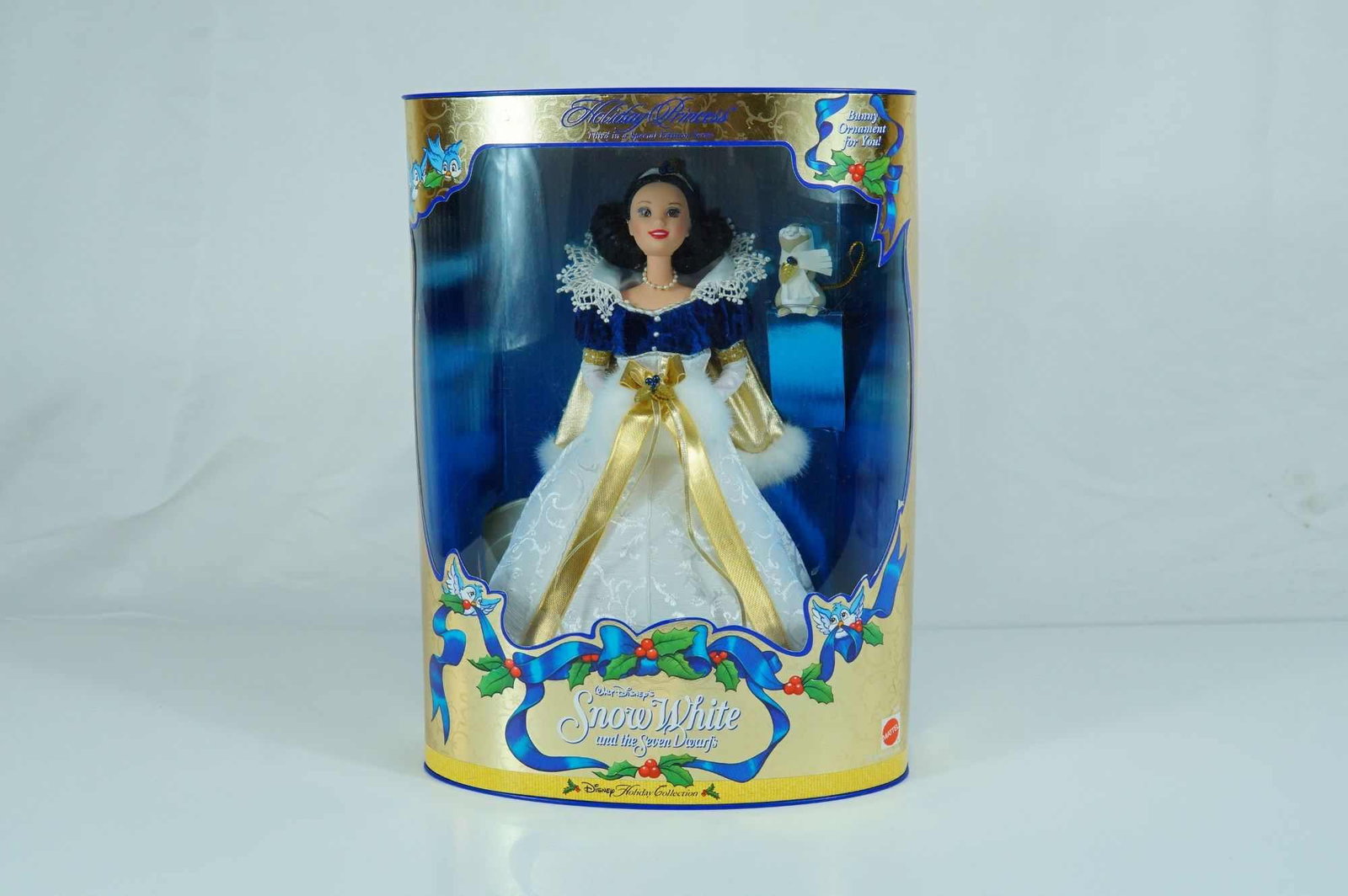 Mattel Disney Holiday Princess Snow White Doll, 11.5-inch: Produced by Mattel, Inc., this vinyl fashion doll depicts the character Snow White and is part of the Disney Holiday Collection, serving as the third release in this Special Edition series. The doll