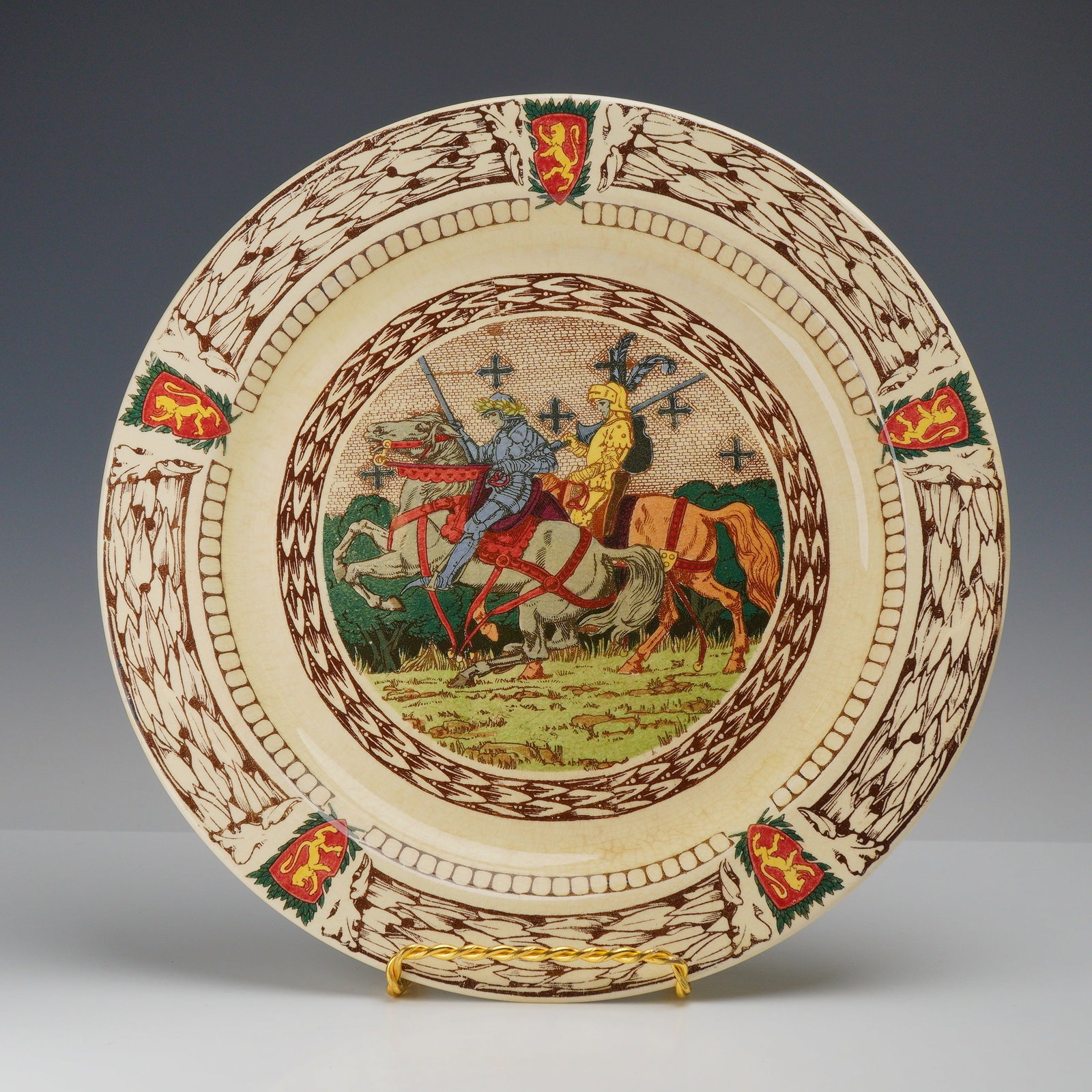 Royal Doulton King Arthur's Knights Seriesware Platter D2961: This Royal Doulton earthenware platter belongs to the King Arthur's Knights series, part of the company's extensive Seriesware line produced in the early 20th century. The central well features a poly
