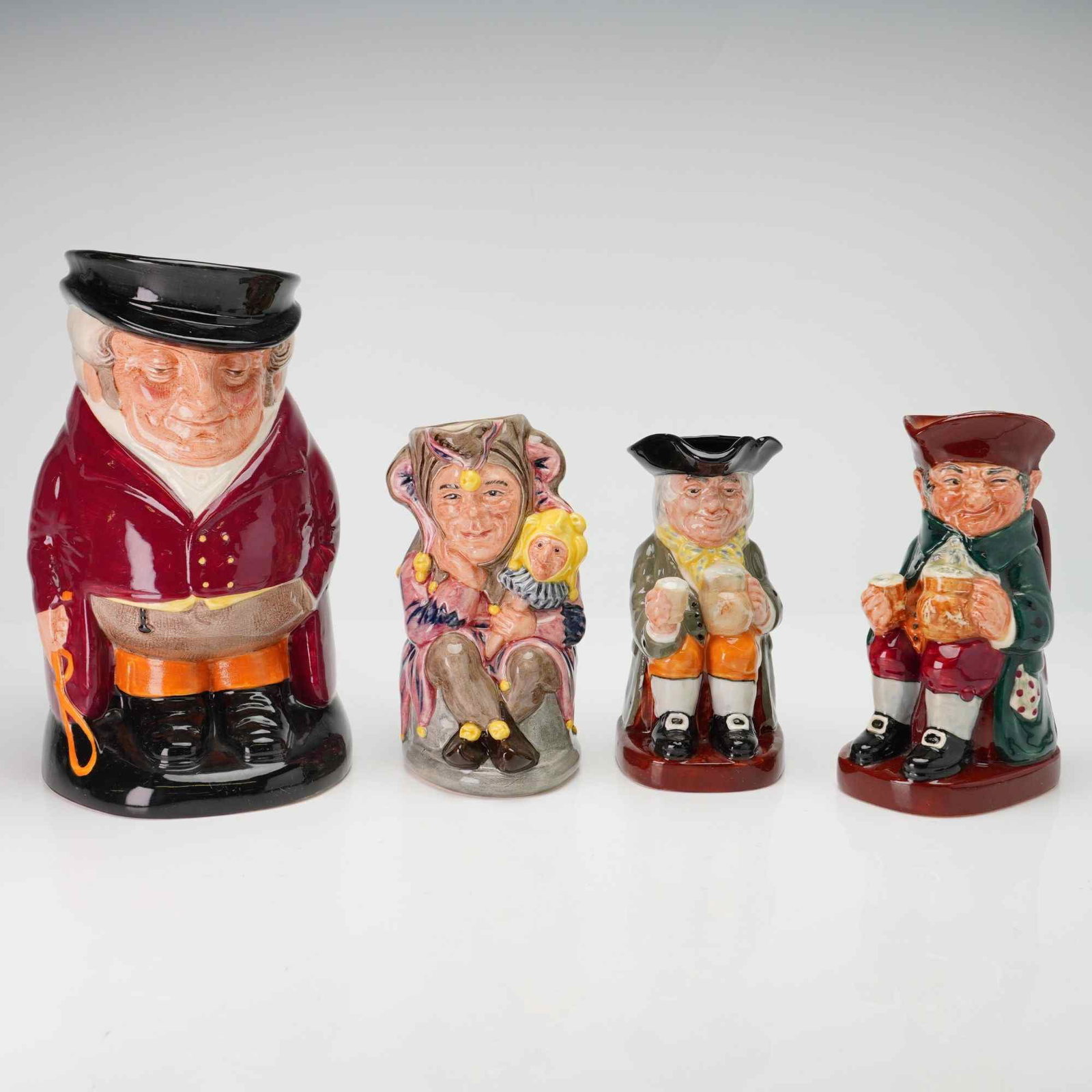 4pc Royal Doulton Toby Jugs Including The Huntsman, The Jester, Old Charlie, and Happy John (1 of 4)