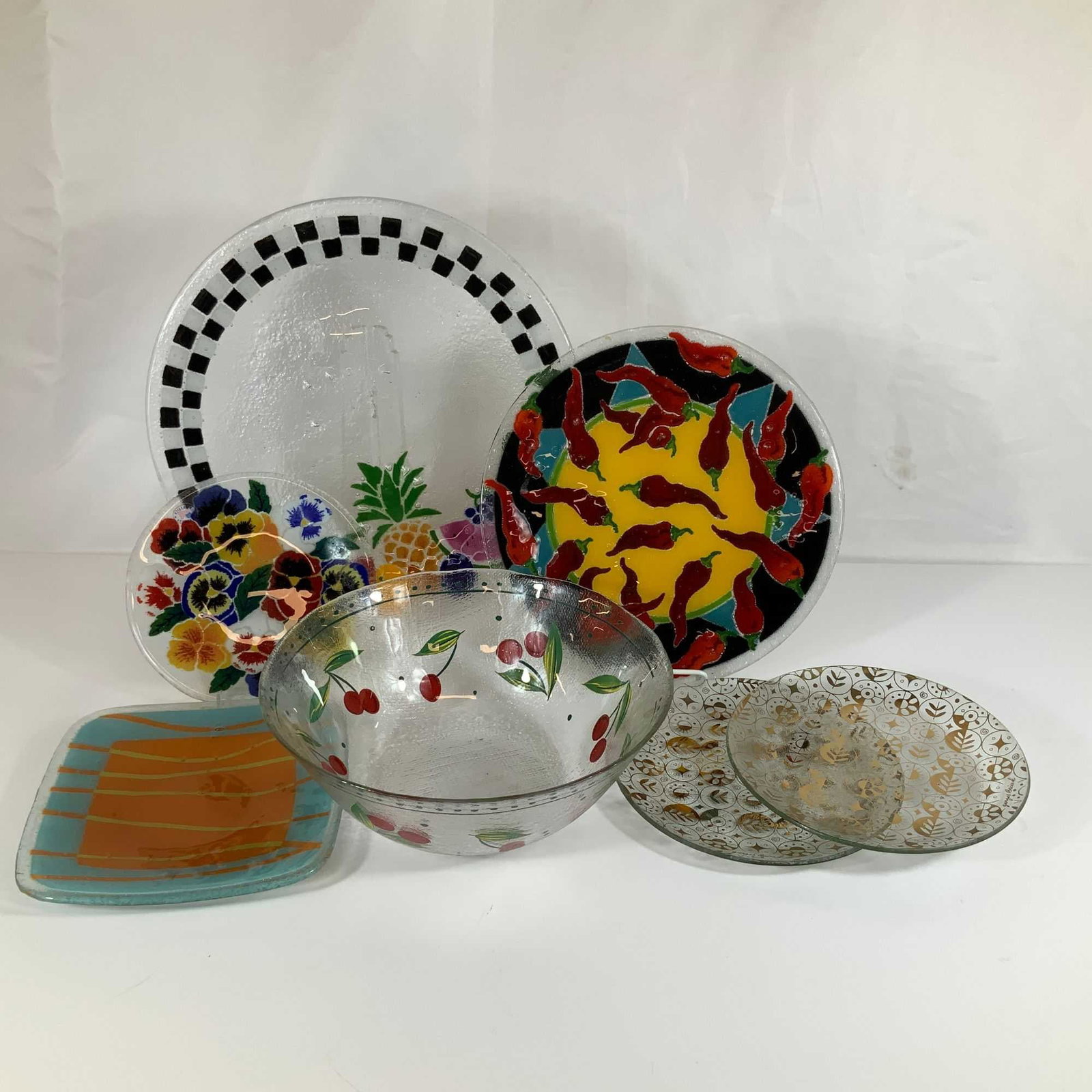 7 Fused Art Glass Plates and Bowl Including Peggy Karr and Georges Briard: This collection of seven glass items includes several pieces of fused art glass attributed to Peggy Karr and two signed pieces by Georges Briard. The Peggy Karr pieces consist of a large circular