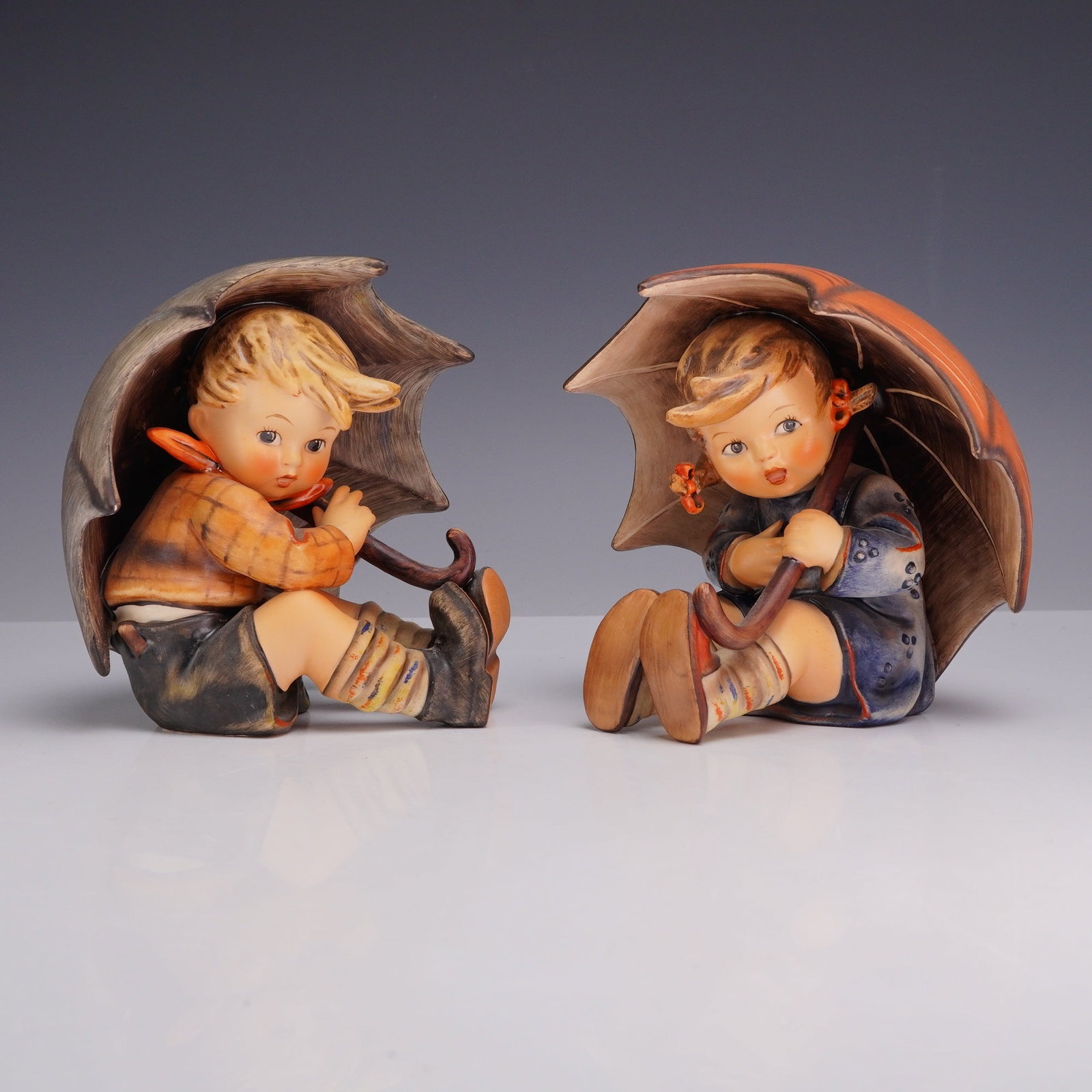 A Pair of Goebel Hummel Ceramic Figurines, Umbrella Boy and Umbrella Girl (1 of 4)