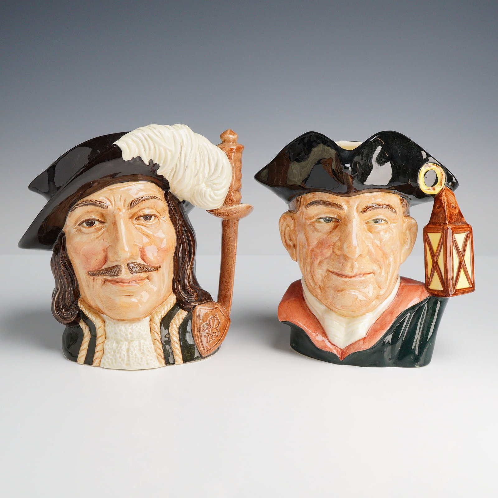 Royal Doulton Athos and Night Watchman Large Character Jugs: A pair of large Royal Doulton character jugs crafted in fine earthenware at the Burslem, England factory. Both pieces were modeled by Max Henk and feature molded, hand-painted underglaze decoration wi