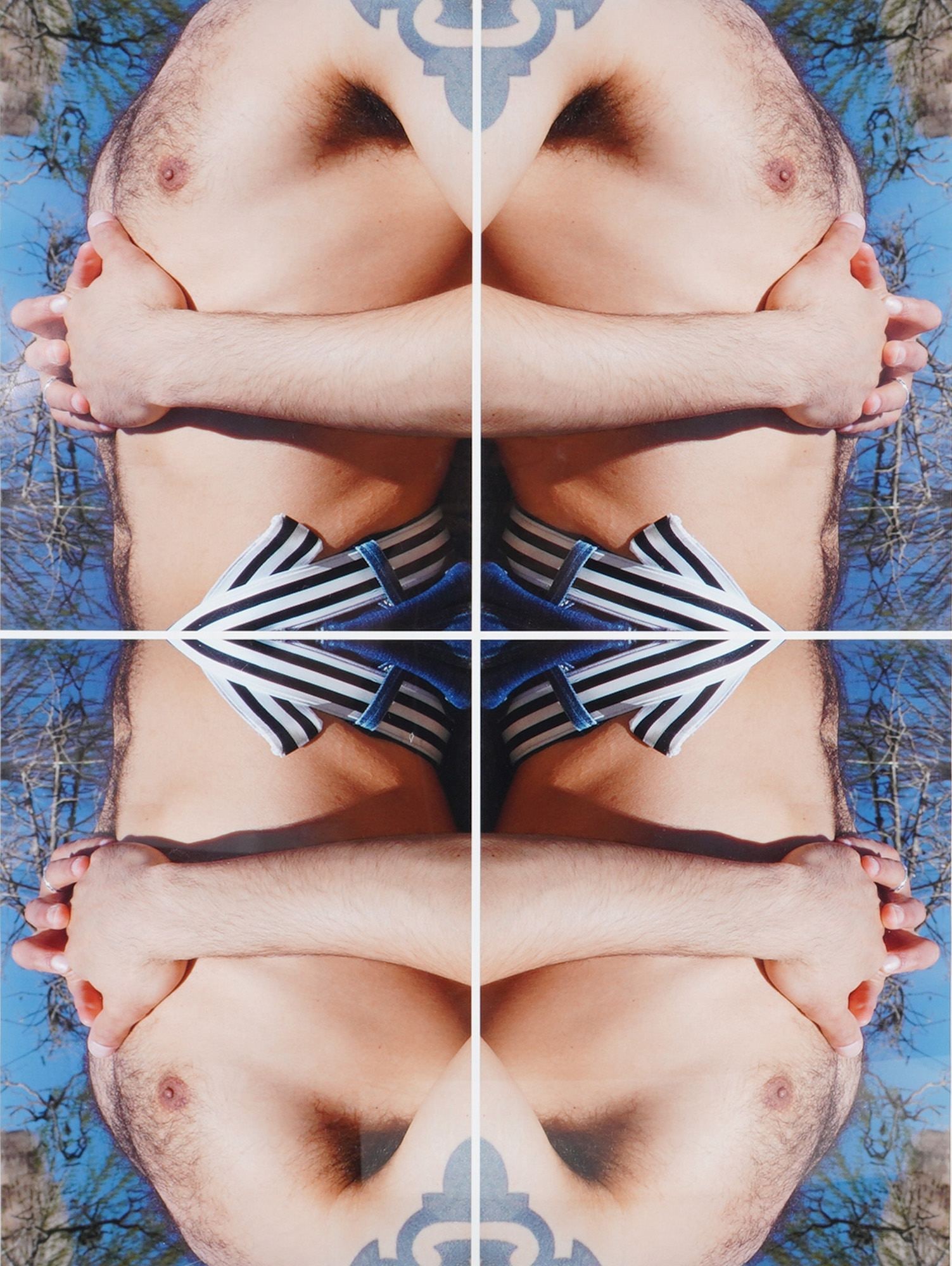 A Contemporary Framed Color Photographic Print of a Male Torso: A framed contemporary color photographic print featuring a four-panel, mirrored composition of a male torso. The subject is shown with arms crossed over the chest, a visible shoulder tattoo, and