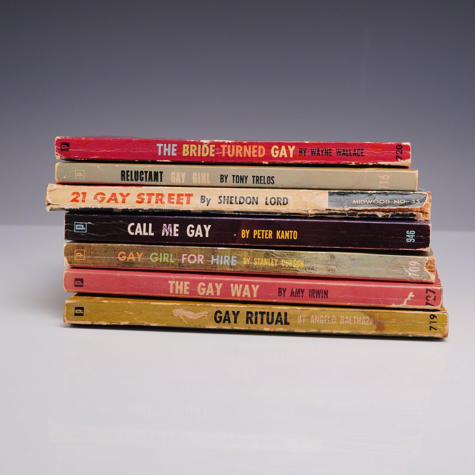 7pc Lesbian Pulp Fiction Novels. Brandon House and Midwood, circa 1958-1965.: This 7-piece collection of vintage mass-market paperbacks showcases the mid-century lesbian pulp fiction genre, specifically focusing on titles utilizing the era's contemporary "gay" terminology. The