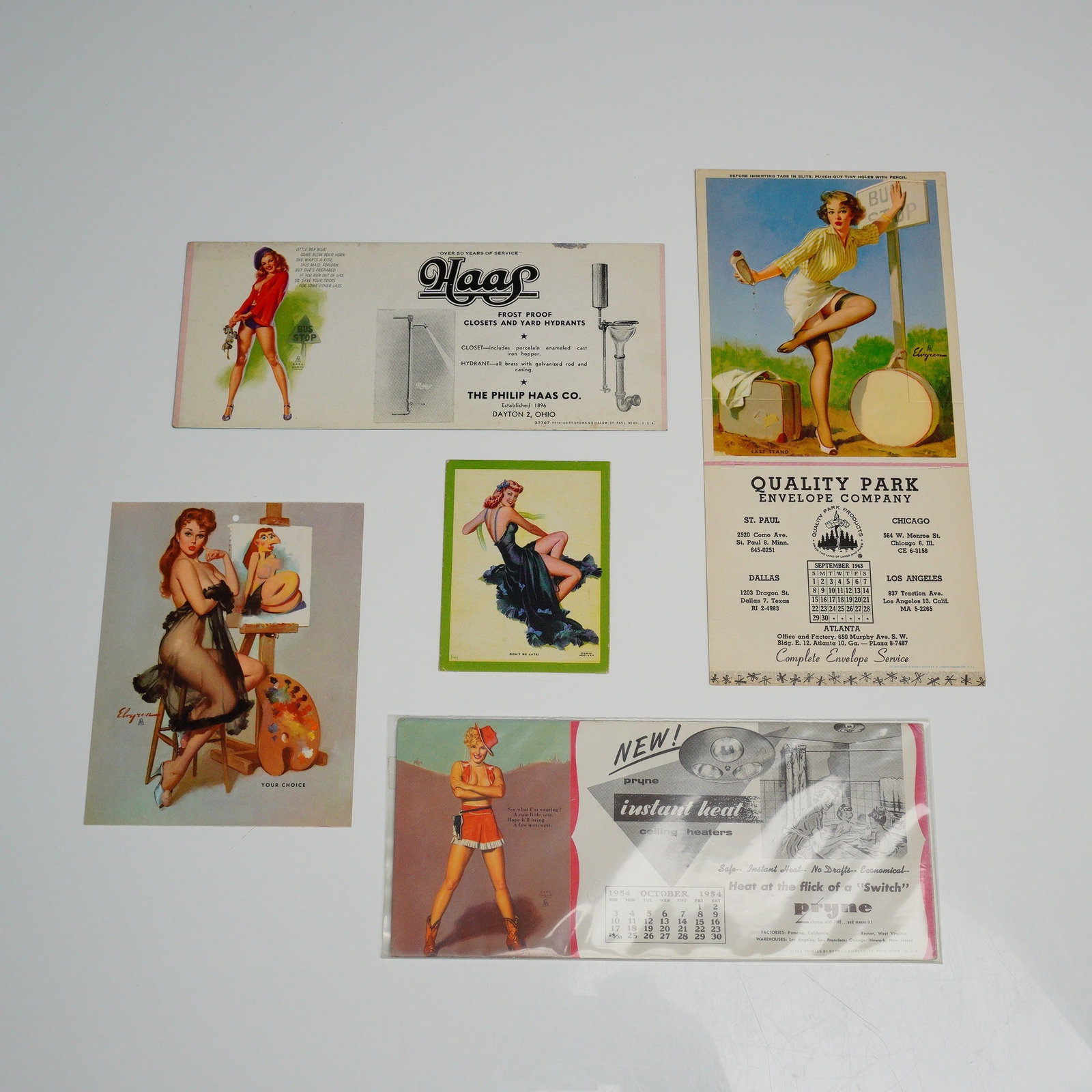 5pc Collection of Vintage Pin-Up Advertising Ephemera Including Gil Elvgren Art: This 5pc pin-up ephemera collection consists of mid-century promotional advertising materials. The lot features a Philip Haas Co. bi-fold pamphlet for frost-proof closets and yard hydrants with hitchh