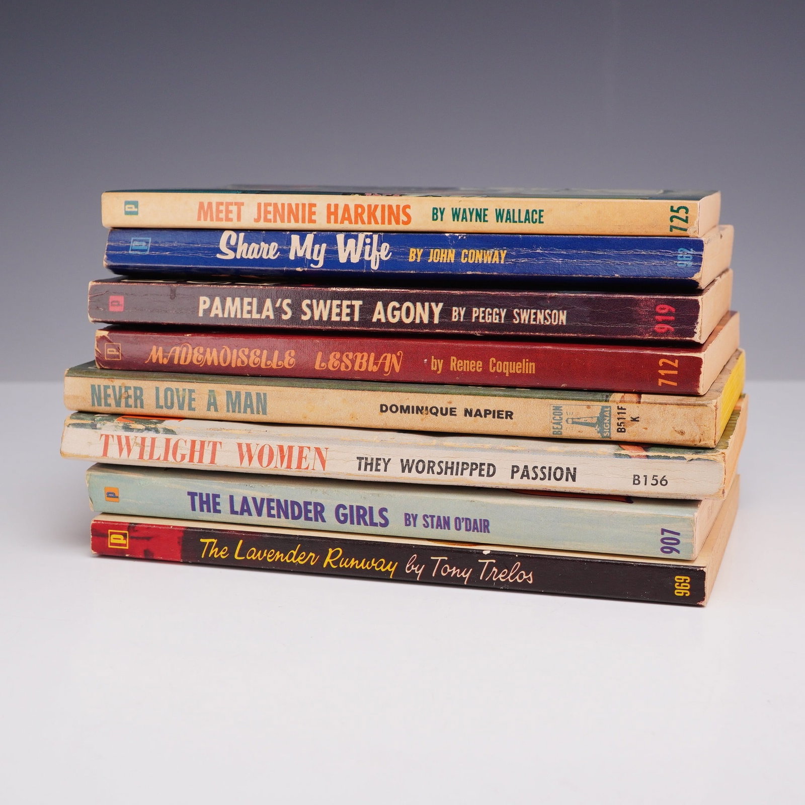 8pc Lesbian Pulp Fiction Collection. Brandon House and Beacon Signal, c. 1953-1965.: This 8-piece collection of vintage mass-market paperbacks explores the mid-century lesbian pulp and sleaze fiction genres. Issued primarily by Brandon House and Beacon Signal, the lot includes Meet Je