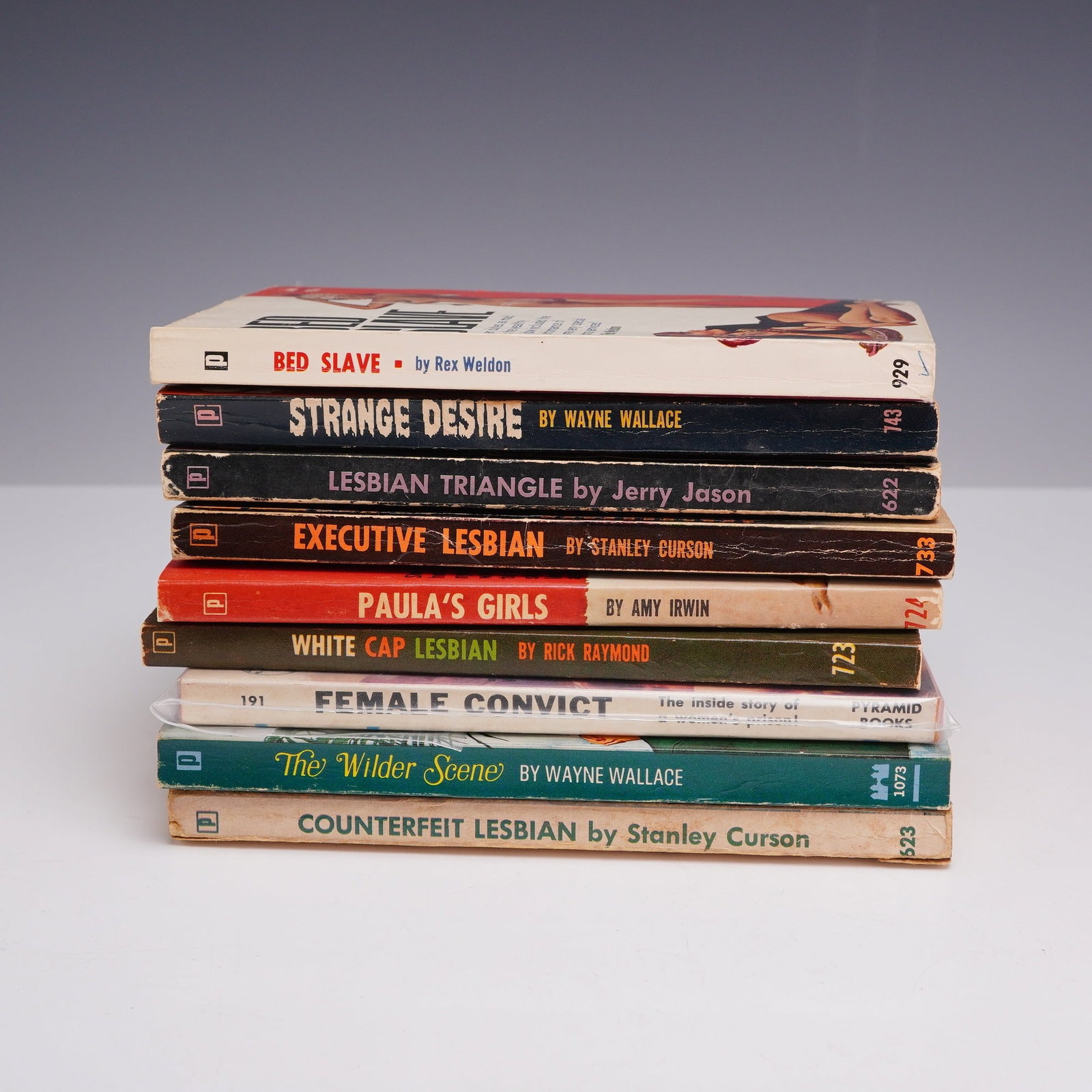 9pc Lesbian Pulp Fiction Books. Brandon House and Pyramid Books, c. 1950-1965.: This 9-piece collection of vintage mass-market paperbacks focuses on mid-century lesbian-interest and sleaze pulp fiction. The lot features eight titles from Brandon House and one from Pyramid Books, 