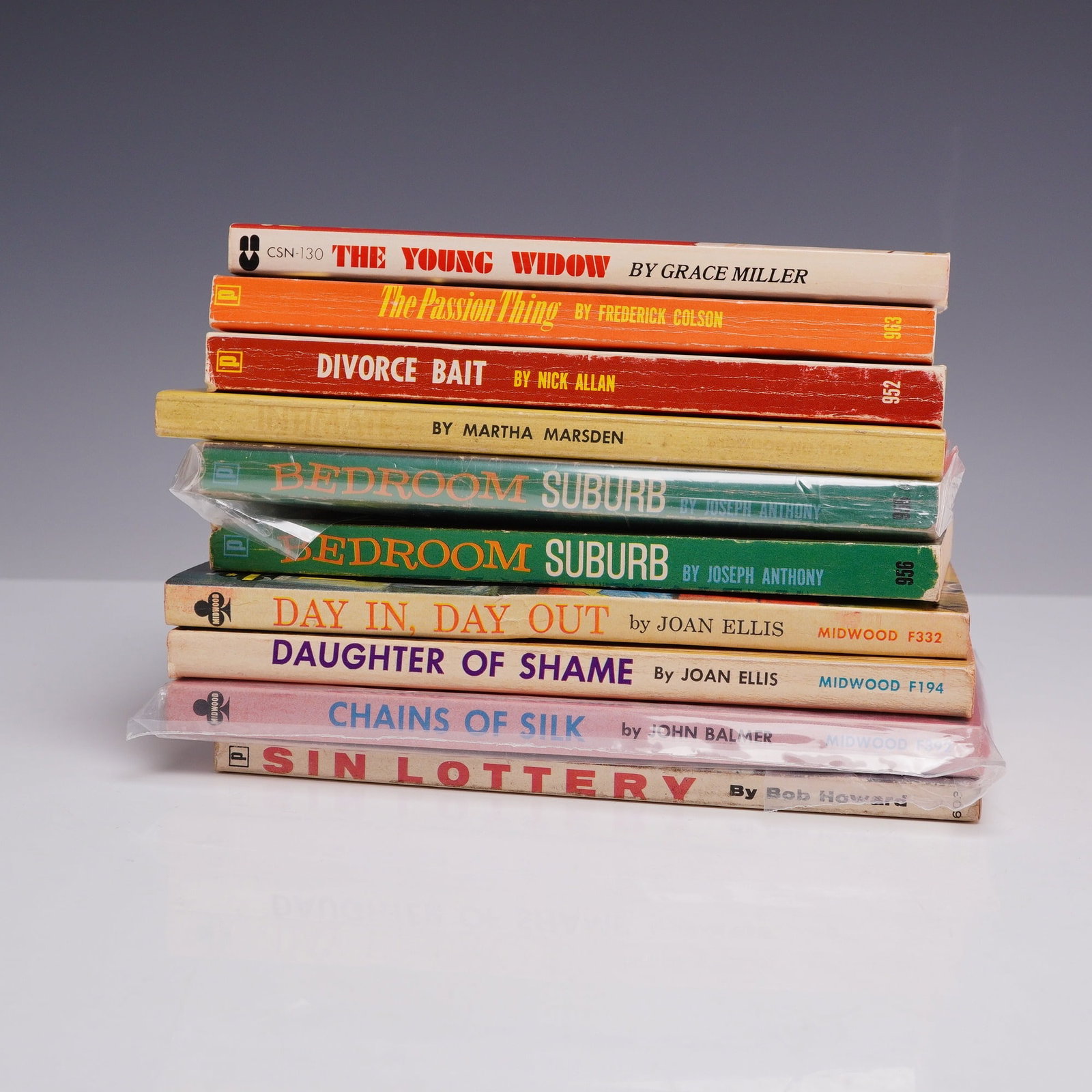 10pc Erotica Sleaze Pulp Fiction Books. Midwood, Brandon House, and Others, c. 1960s.: This 10-piece collection of vintage mass-market paperbacks highlights the adult pulp and sleaze fiction genres of the mid-20th century. The lot features Intimate by Martha Marsden (Midwood), Divorce B