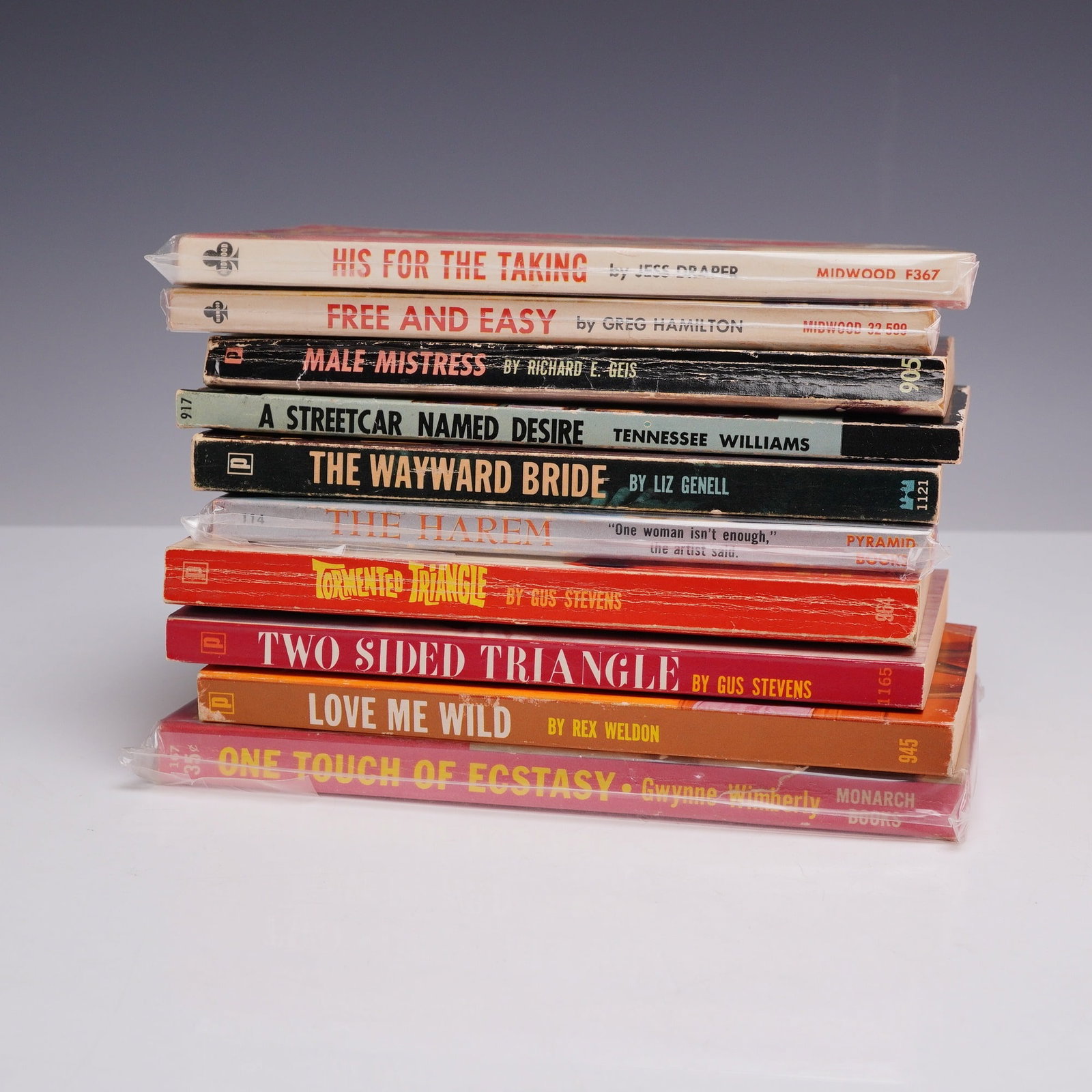 10pc Mid-Century Sleaze and Erotica Pulp Fiction Paperbacks. Various Publishers, c. 1950-1965.: This 10-piece collection of vintage mass-market paperbacks features a provocative selection of mid-century adult pulp and sleaze fiction. The assortment includes His For The Taking by Jess Draper (Mid