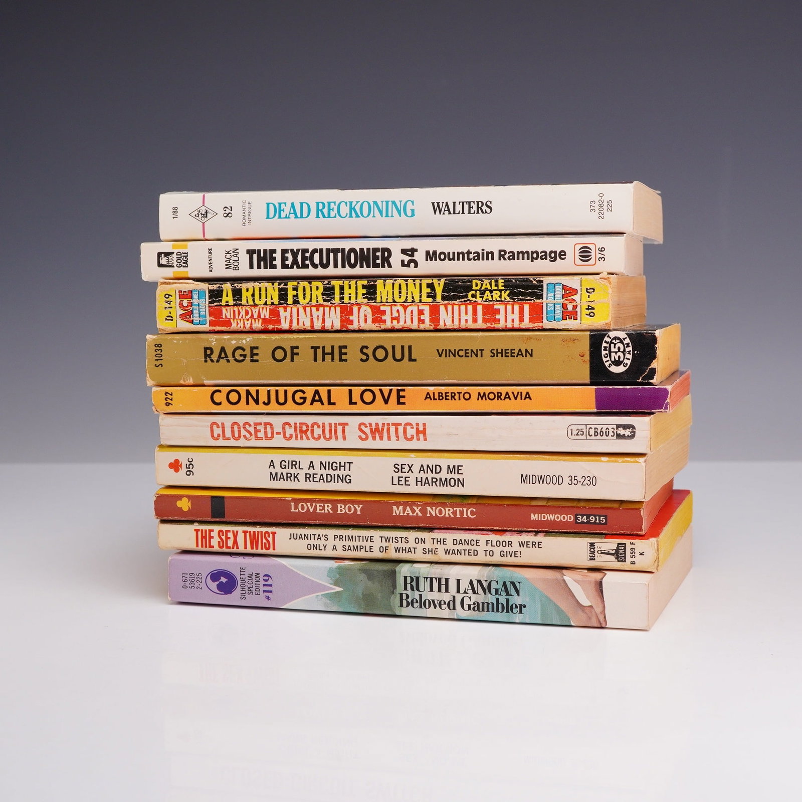 10pc Pulp Fiction and Sleaze Erotica Paperback Books, 1952-1988: This 10-piece collection features a diverse range of vintage mass-market paperbacks spanning mid-century hardboiled crime, pulp fiction, and adult sleaze. The selection includes Rage of the Soul and C