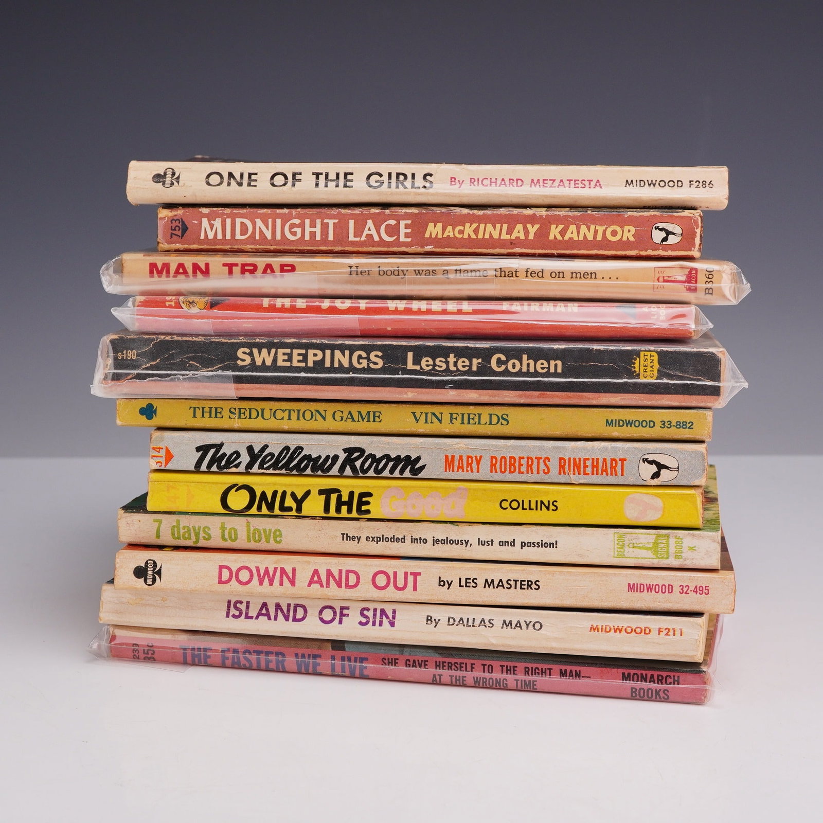 12pc Erotica Sleaze Pulp Fiction Paperback Books. Multiple Publishers, c. 1945-1966.: This collection of 12 vintage mass-market paperbacks highlights mid-20th-century pulp fiction and adult sleaze genres, characterized by their bold, sensationalist cover art. The lot includes One of th