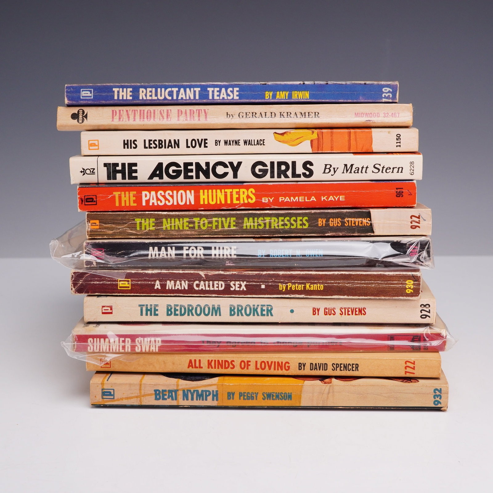 12pc Vintage Erotica Sleaze Pulp Fiction Paperbacks. Various Publishers, circa 1960s.: This lot consists of a collection of 12 vintage mass-market paperback books representing the mid-century erotica and sleaze pulp fiction genre. The assembly primarily features volumes published by Bra