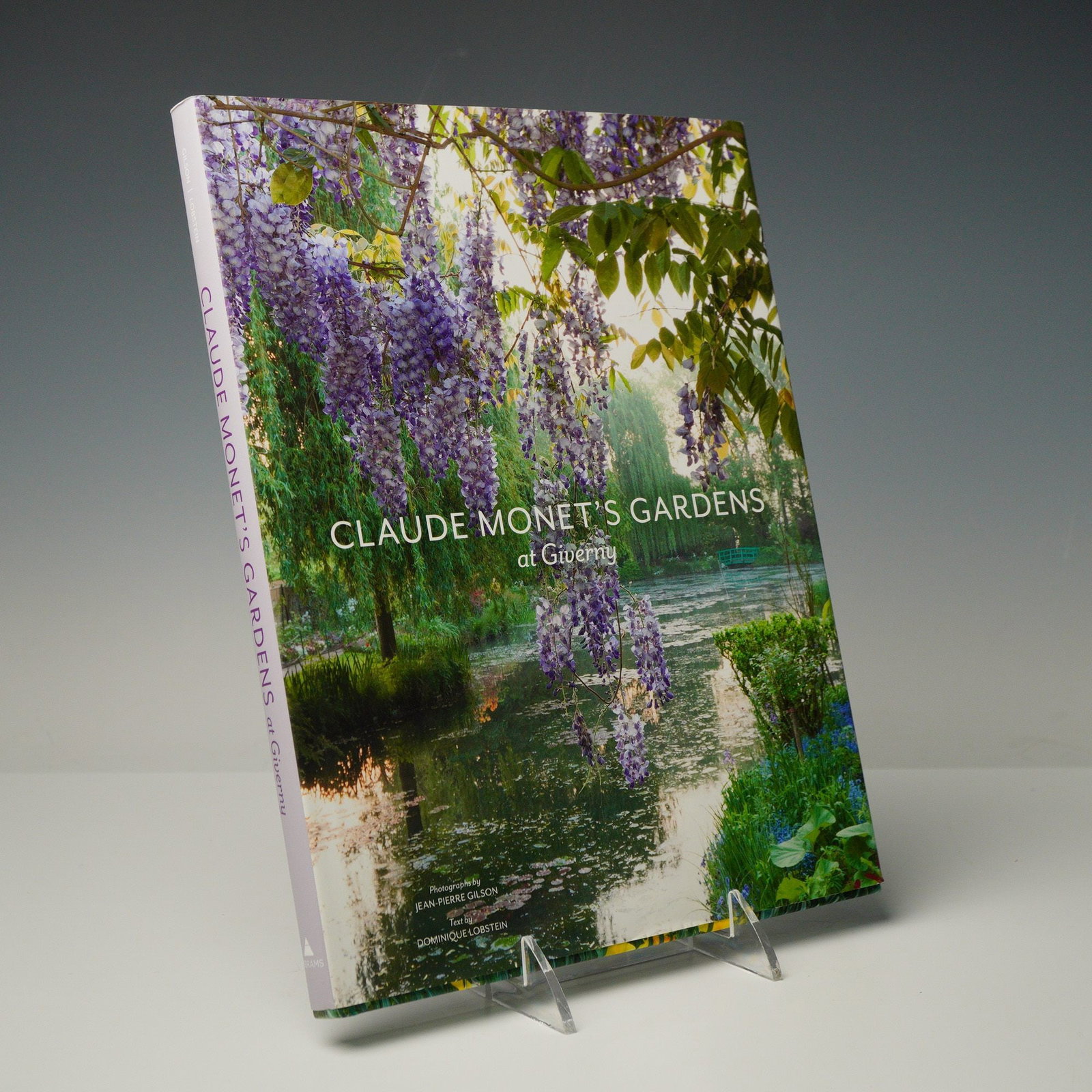Claude Monet's Gardens at Giverny by Dominique Lobstein: A contemporary hardcover volume titled Claude Monet's Gardens at Giverny, authored by Dominique Lobstein with photography by Jean-Pierre Gilson. The book was published by Abrams in association with
