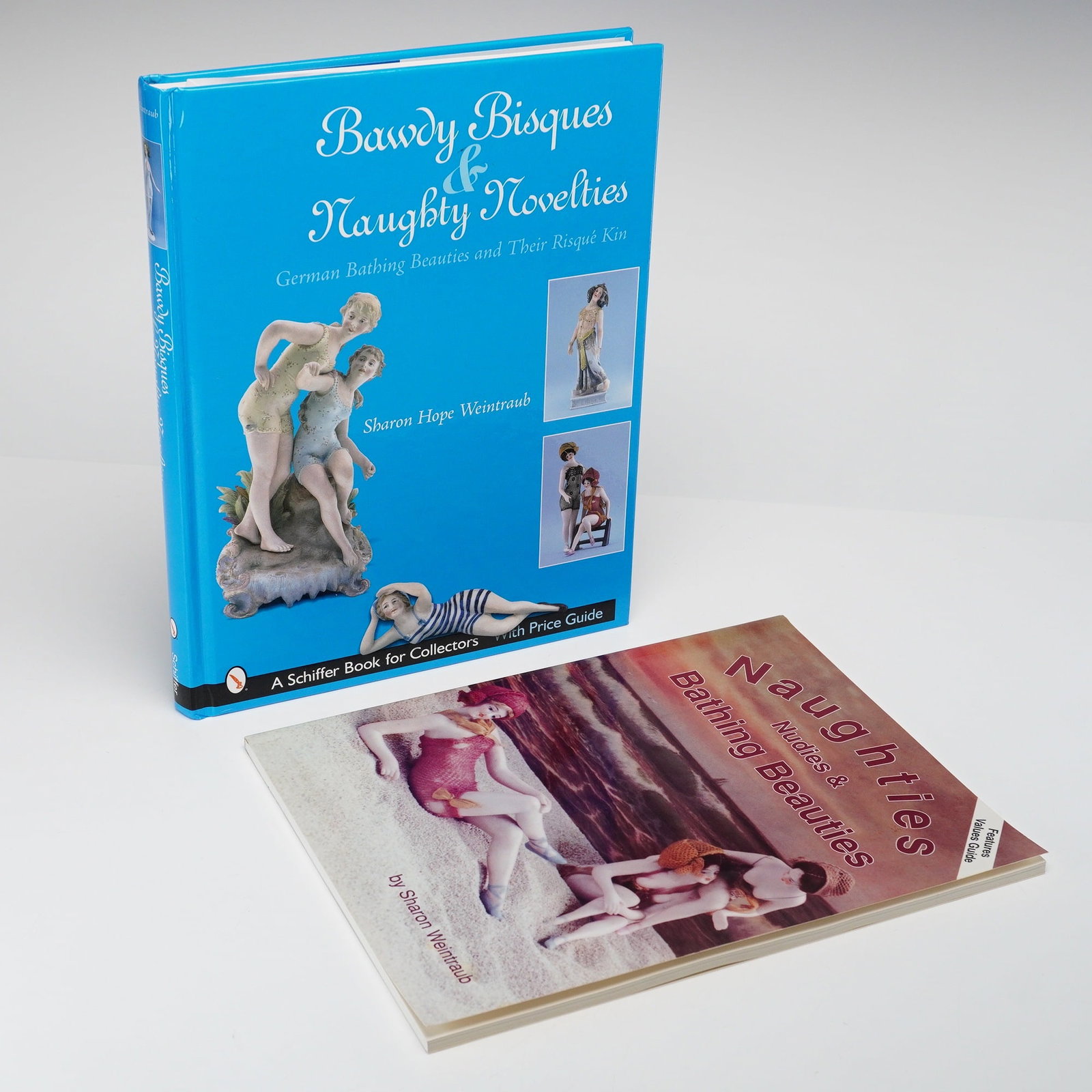 2pc Bawdy Bisques and Bathing Beauties Reference Books: This lot consists of two specialized reference volumes by author Sharon Weintraub focusing on antique collectible figurines. The first volume is titled Bawdy Bisques & Naughty Novelties: German