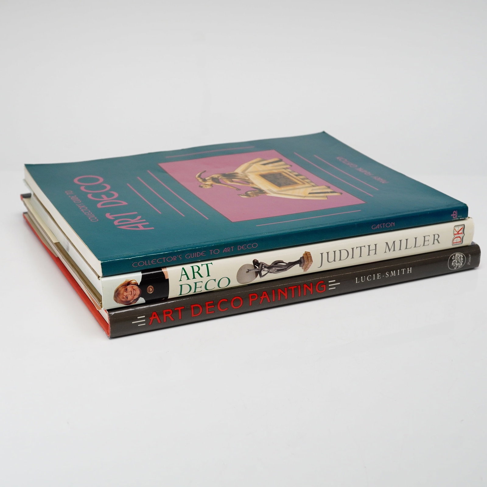 3pc Art Deco Reference Books: A lot of three reference books focused on the Art Deco movement and style. The collection includes: Edward Lucie-Smith, Art Deco Painting, New York: Clarkson N. Potter, Inc. and London: Phaidon Press