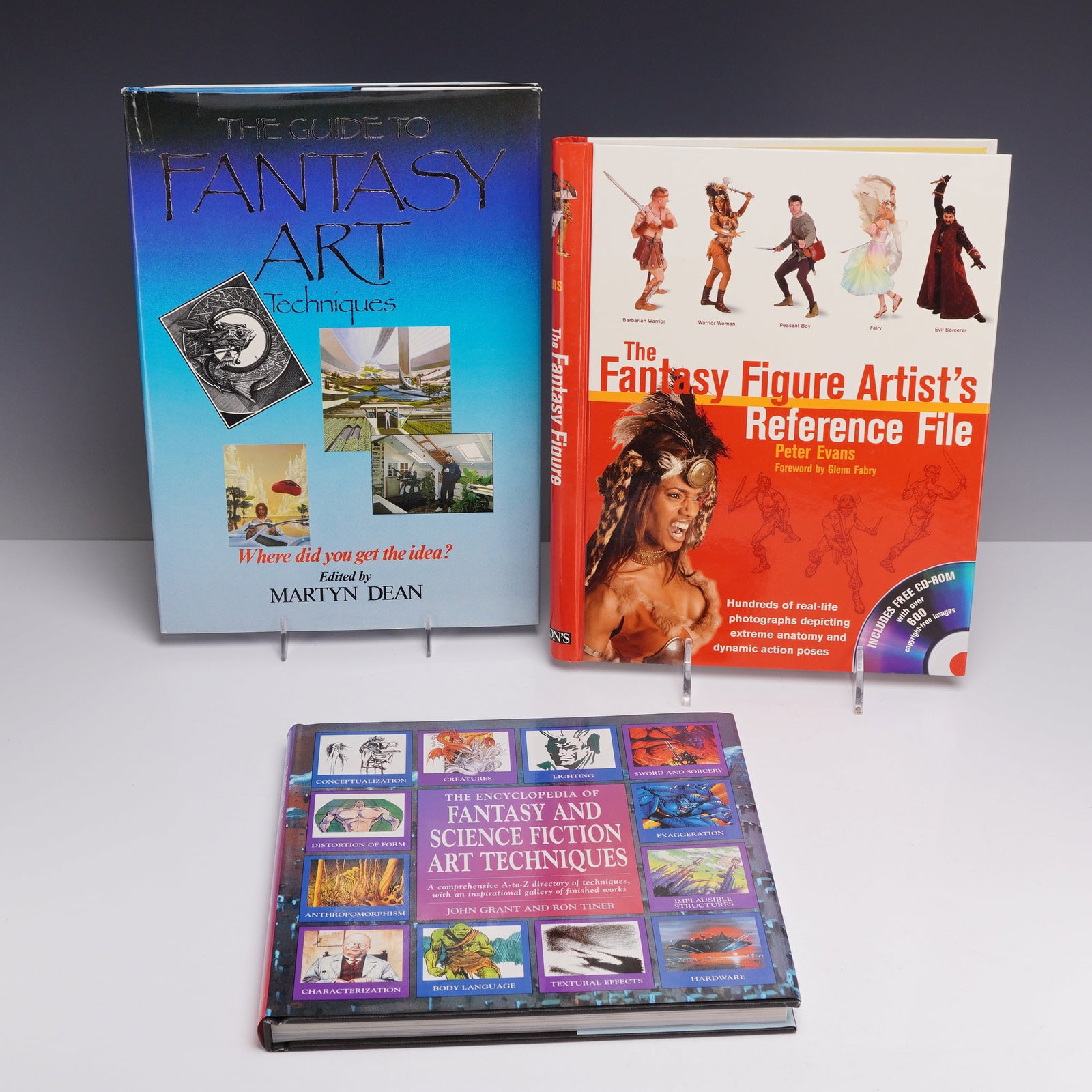 3pc Fantasy Art Reference Books,1984-2006: This collection consists of three hardcover reference books focused on the technical methods of fantasy and science fiction art. The group includes: The Guide to Fantasy Art Techniques, edited by Mart