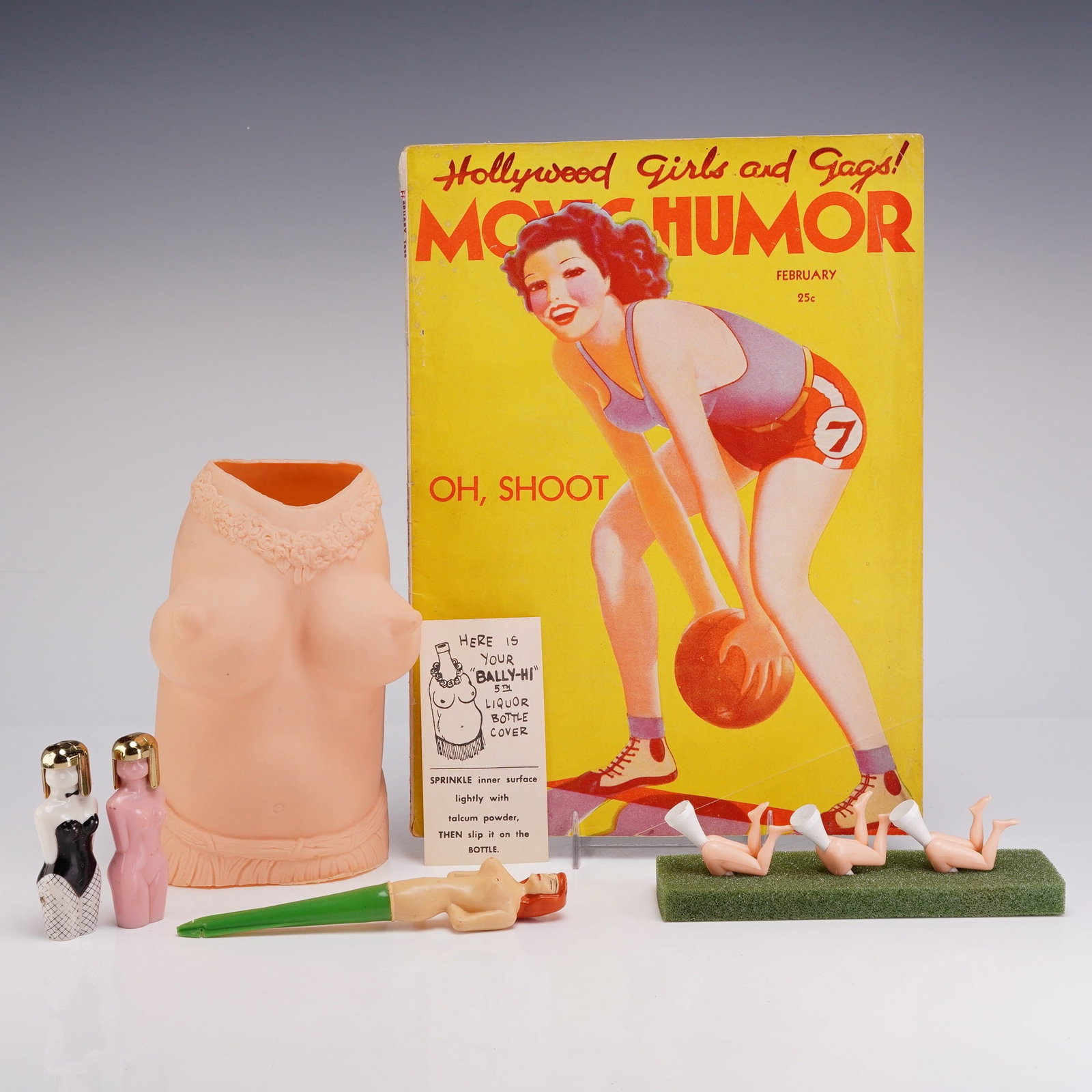 5pc Mid-Century Erotic Humor Ephemera and Novelties: This collection features five mid-20th-century adult-oriented novelty items, magazine ephemera, and barware accessories, including sexy items, bottle covers, and golf tees. The lot includes a February