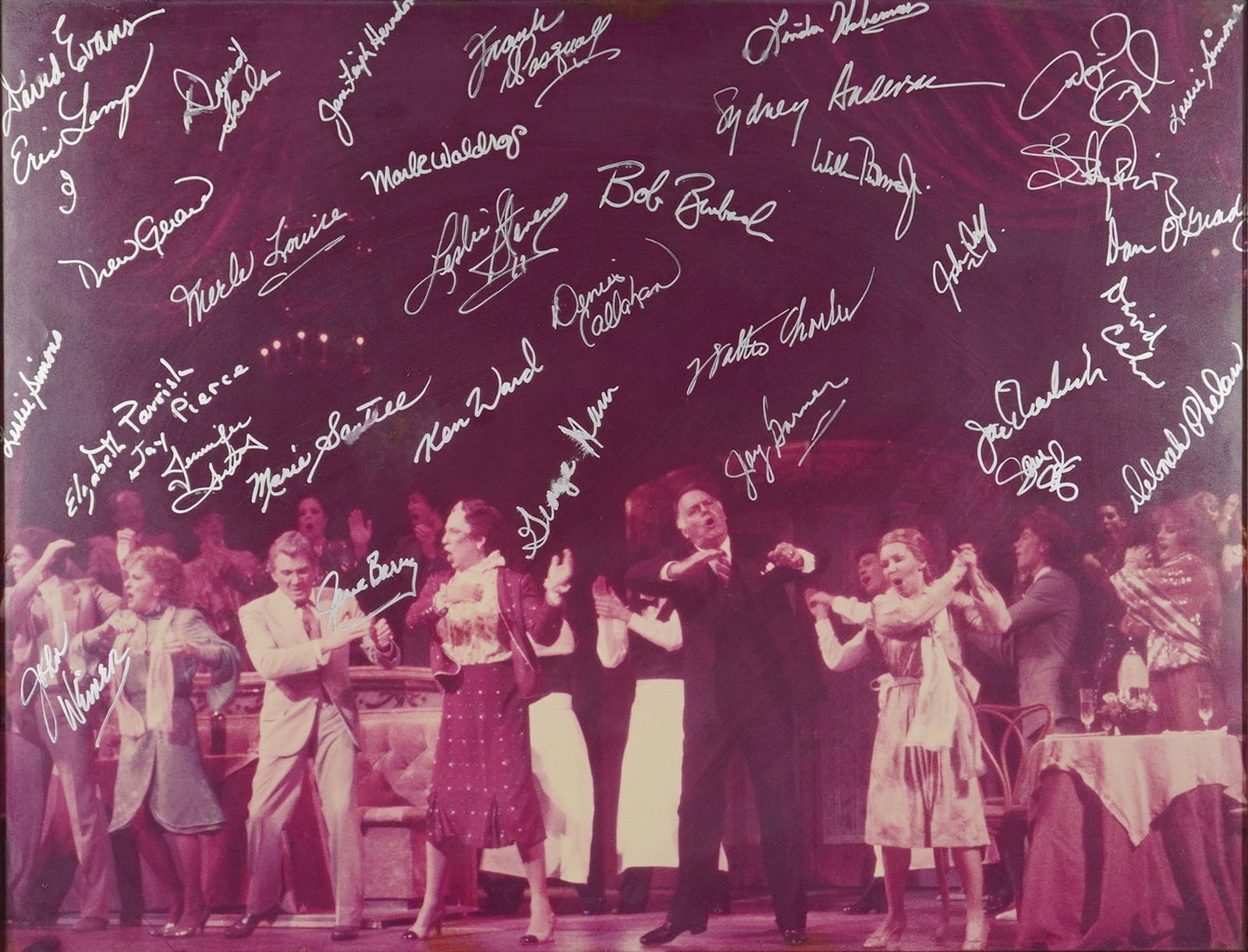 Leonard Bernstein's On the Town Autographed Cast Photograph Featuring Moule Waldros and Ken Ward: This professional auction lot features a framed cast photograph from the Leonard Bernstein musical On the Town, extensively autographed in silver-tone ink by the production ensemble. The photograph in