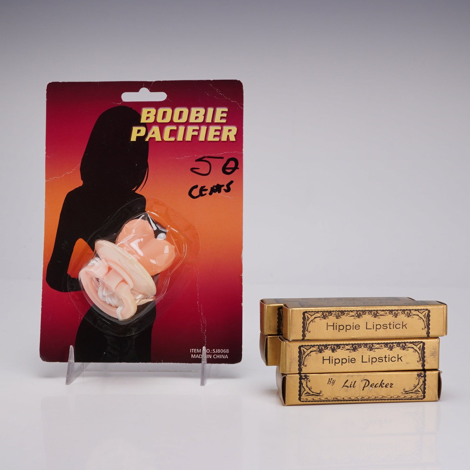 7pc Adult Novelty Gag Gifts Including Boobie Pacifier & Hippie Lipsticks (1 of 3)