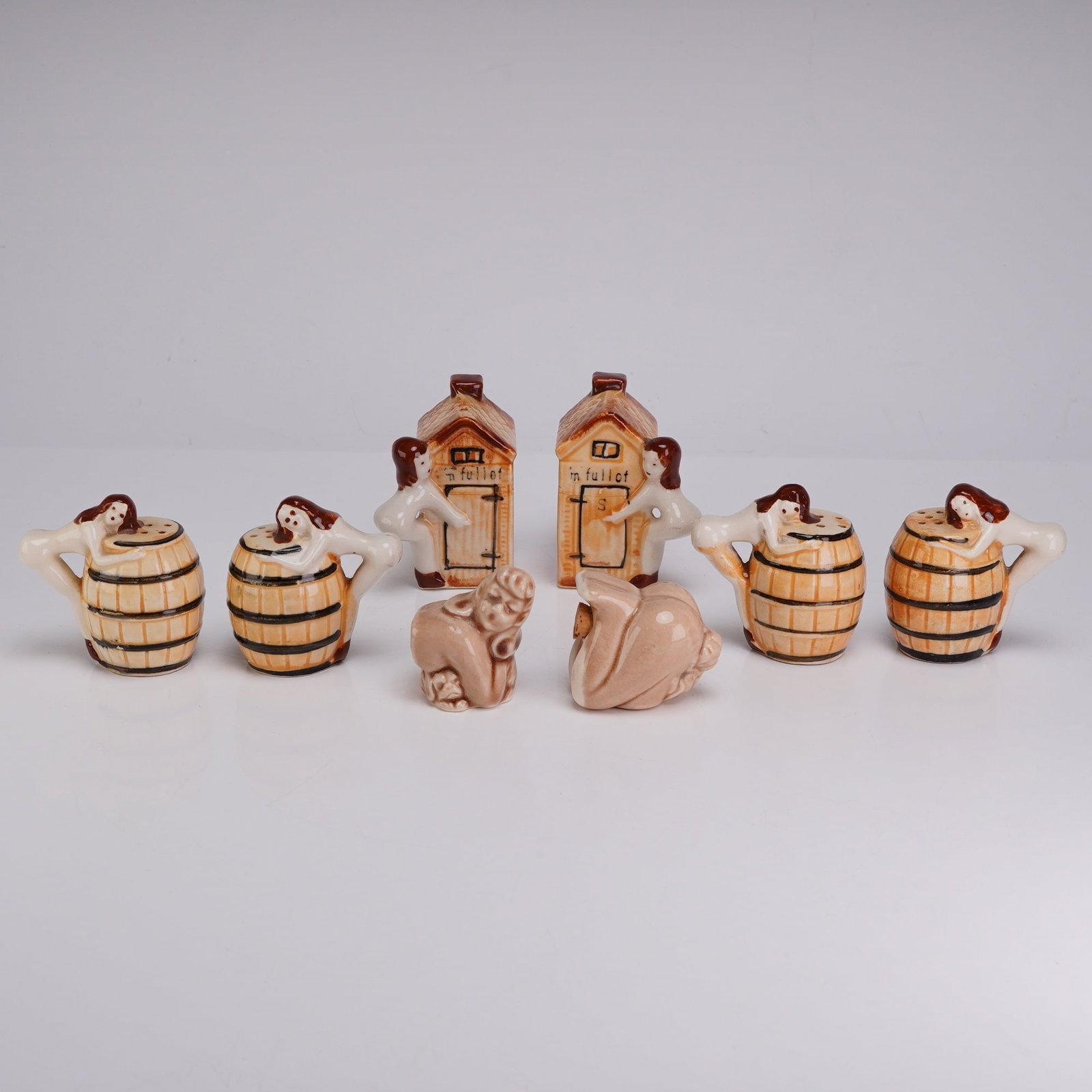 8pc Mid-Century Japanese Novelty Ceramic Salt & Pepper Shakers: This collection consists of eight glazed earthenware salt and pepper shakers produced in Japan during the mid-20th century. The set includes four shakers modeled as wooden barrels with figural forms