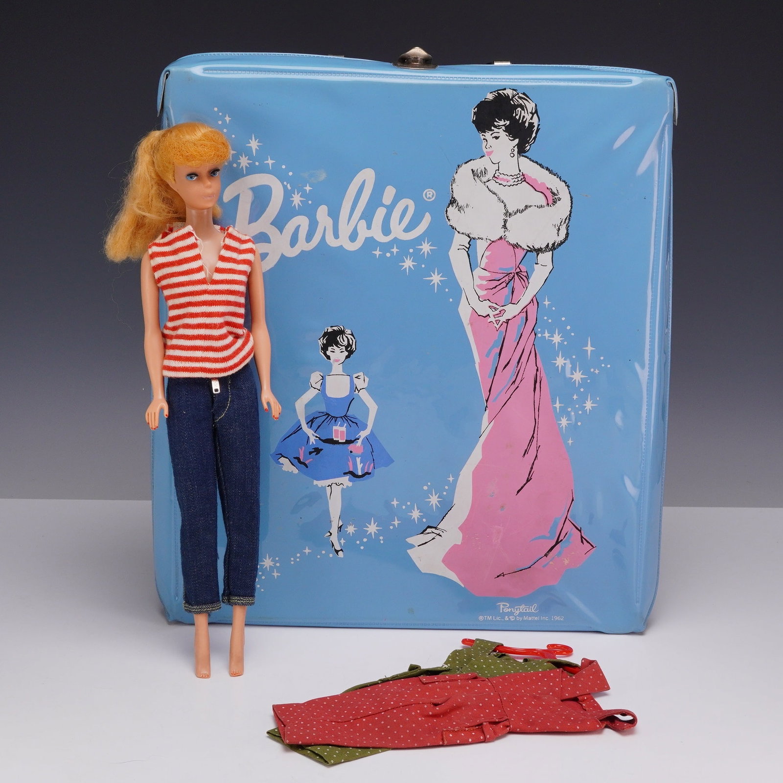 Mattel Barbie Carrying Case Including 1961 Blonde Ponytail Doll, Jeans Outfit and On the Go Dresses: This set comprises a vintage Mattel Barbie fashion doll and associated accessories. The doll is a 1961 model featuring a vinyl body with blonde hair rooted in a ponytail style with curly bangs. The