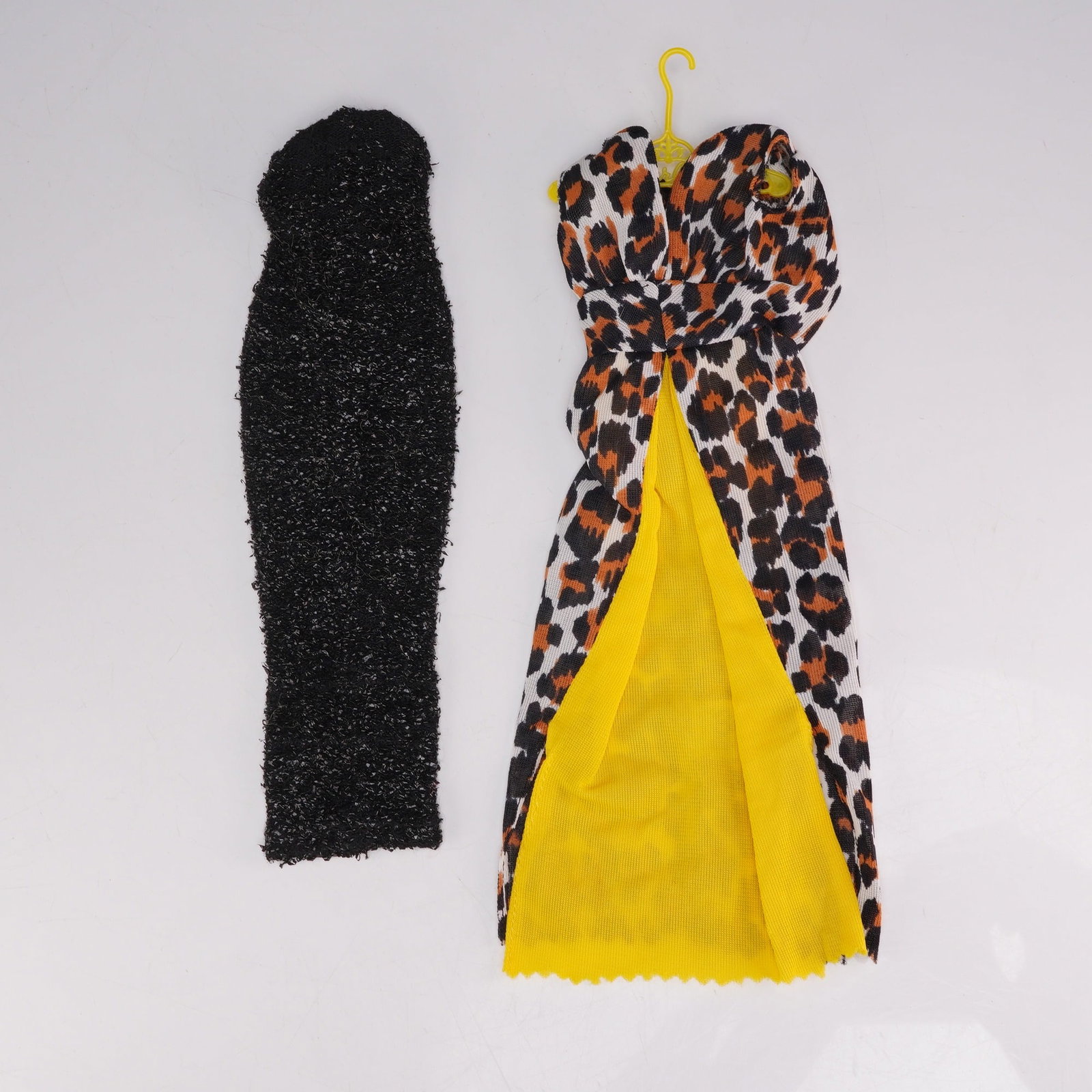 Two Vintage Barbie Fashion Outfits Leisure Leopard and Solo in the Spotlight: This lot features two vintage outfits designed for a standard 11.5-inch fashion doll, such as Barbie. The first garment is identified as the Leisure Leopard ensemble (Outfit #1479), originally