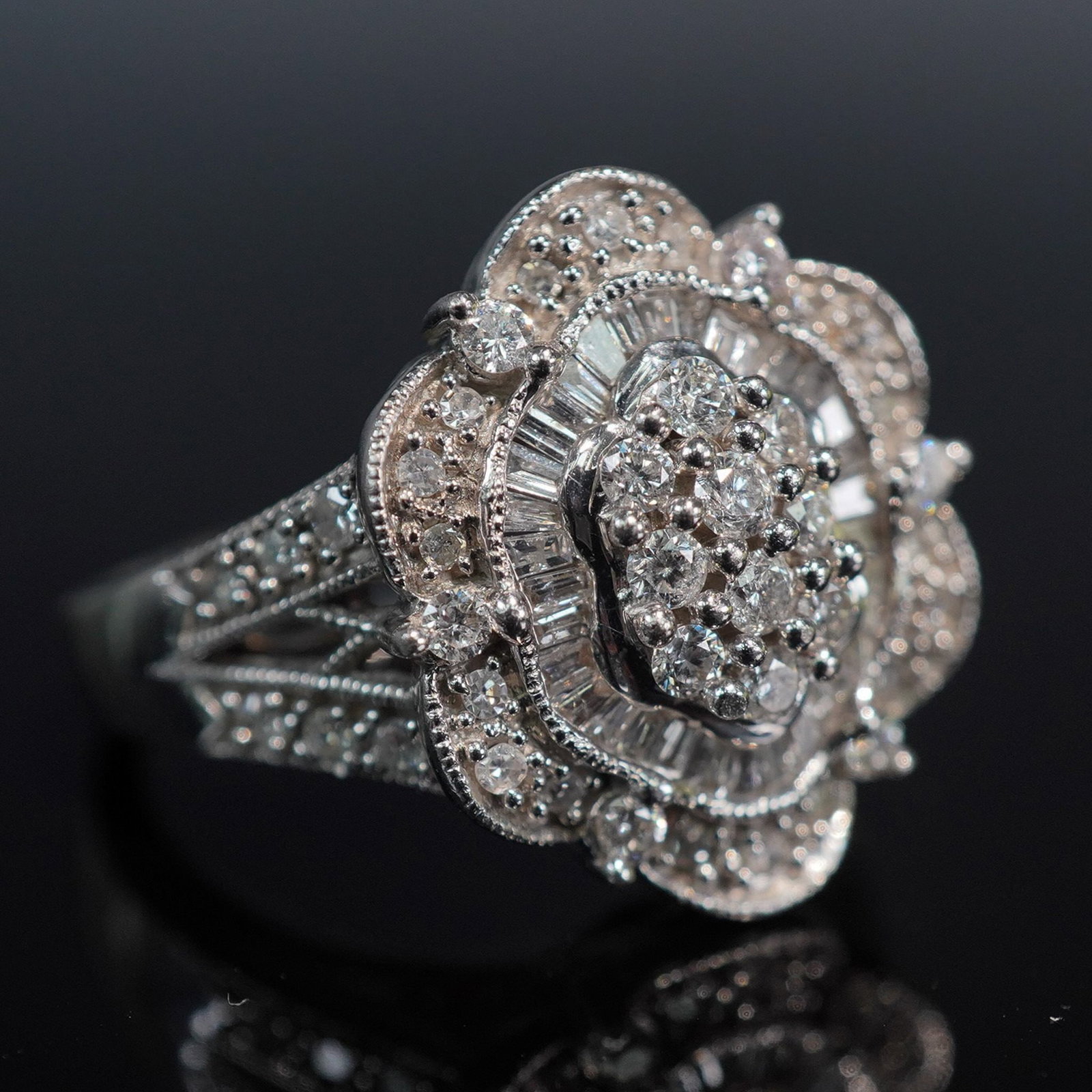 Ladies Exquisite 14KT Art Deco Diamond Ring: Ladies ring crafted in 14kt gold and designed in an Art Deco style, featuring approximately 1.50 carats total weight of diamonds. The ring showcases geometric elements and symmetrical detailing charac