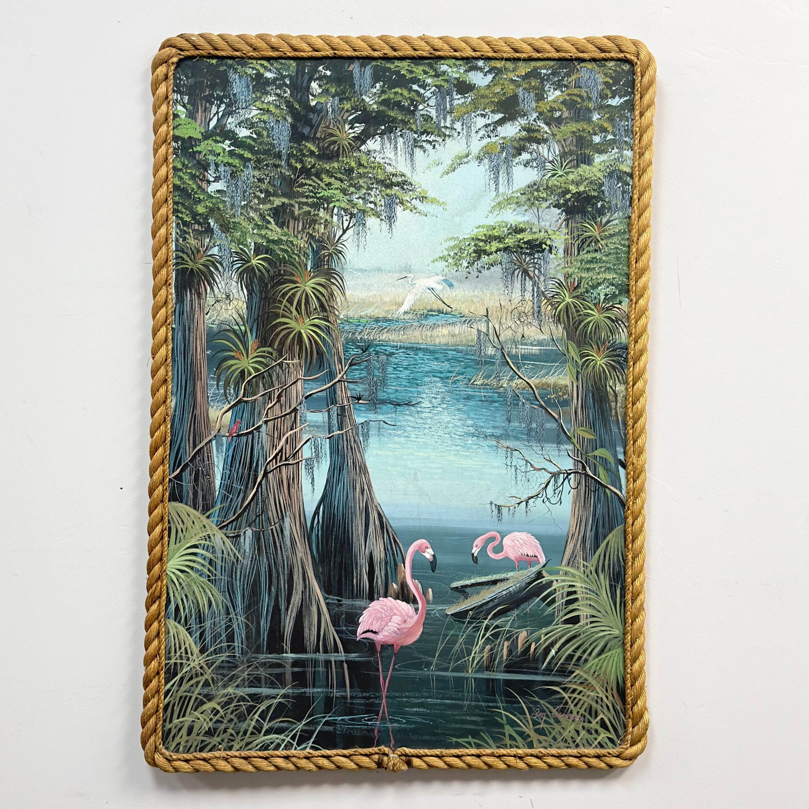 Ben Cannon (American), Everglades Landscape with Flamingos and Egret, Oil on Canvas: This mid-20th-century American marsh landscape, executed in oil on canvas, is by artist Ben Cannon. The composition depicts a lush Florida Everglades scene featuring two pink flamingos in the foregrou