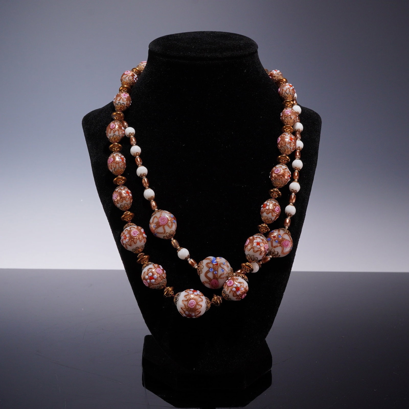 2pc Italian Style Wedding Cake Glass Bead Necklaces: Two costume jewelry necklaces featuring an ornate design with white and pink accents, in the style of mid-20th century Italian Venetian fiorato or wedding cake lampwork glass. Each necklace is compose