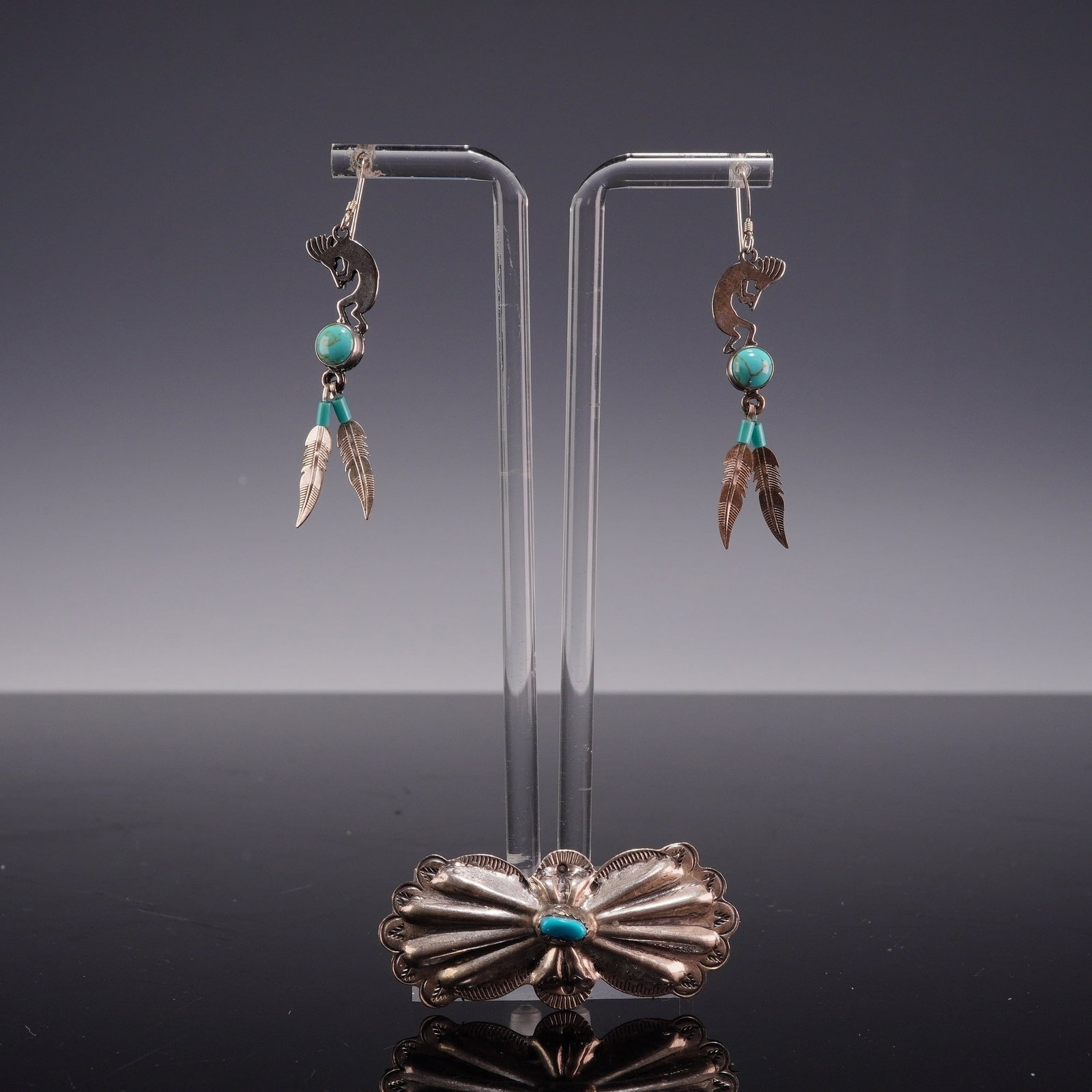 3pc Sterling Silver and Turquoise Southwestern Style Jewelry Set: This three-piece sterling silver jewelry set features turquoise accents in a traditional Southwestern Navajo style. The set consists of a matched pair of dangle earrings and a single brooch. Each earr