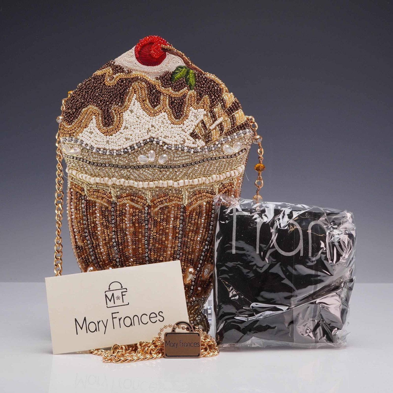Mary Frances What's The Scoop Ice Cream Sundae Beaded Crossbody Handbag: A Mary Frances novelty beaded handbag titled What's The Scoop, designed in the form of an ice cream sundae. The exterior is intricately hand-beaded with chocolate brown, cream, white, amber, gold, and