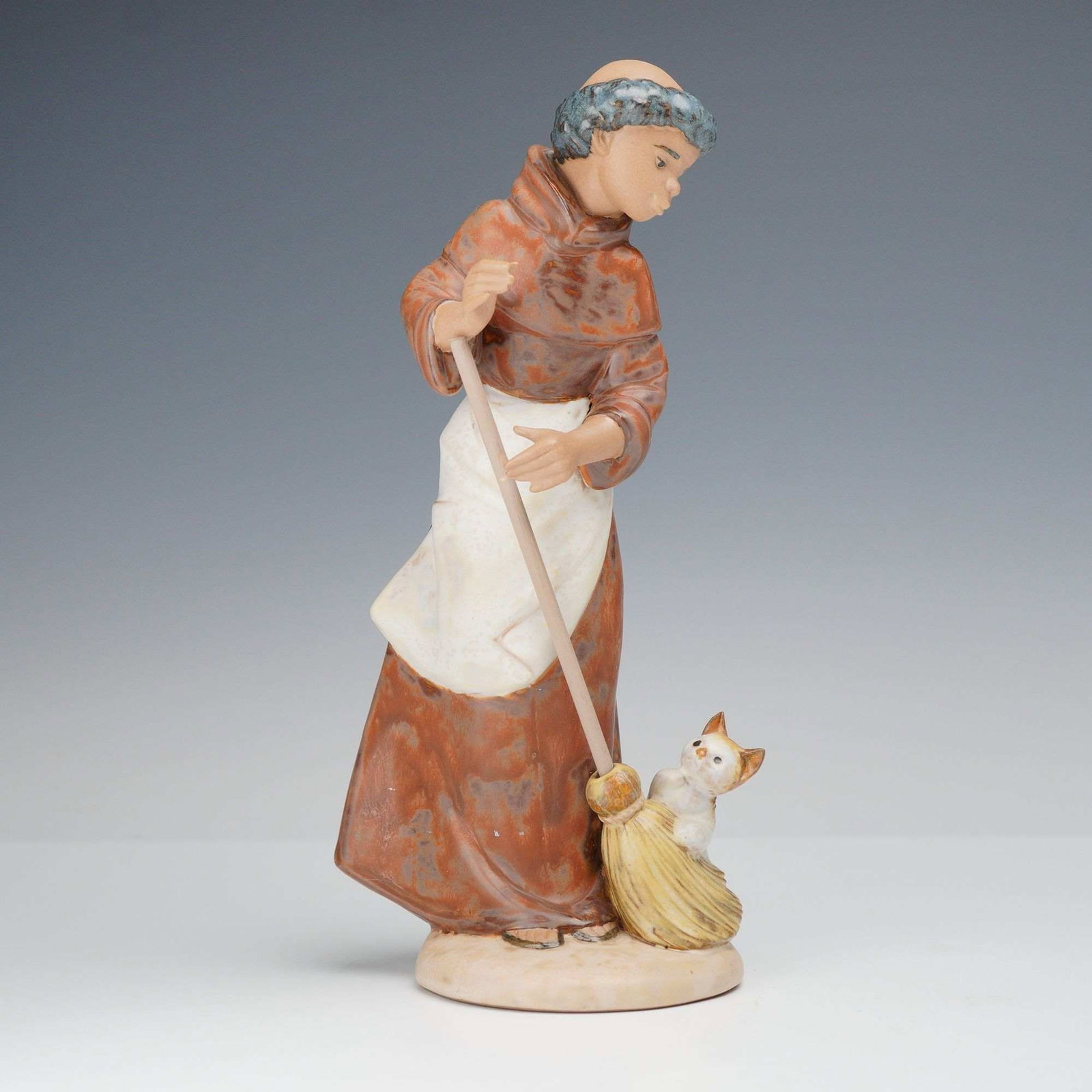 Lladro Gres Porcelain Figurine Afternoon Chores 01012203 with Original Box: This Lladro Gres porcelain figurine, model number 2203, is titled Afternoon Chores. The piece depicts a young monk dressed in a brown hooded habit and a white apron, engaged in sweeping with a long st