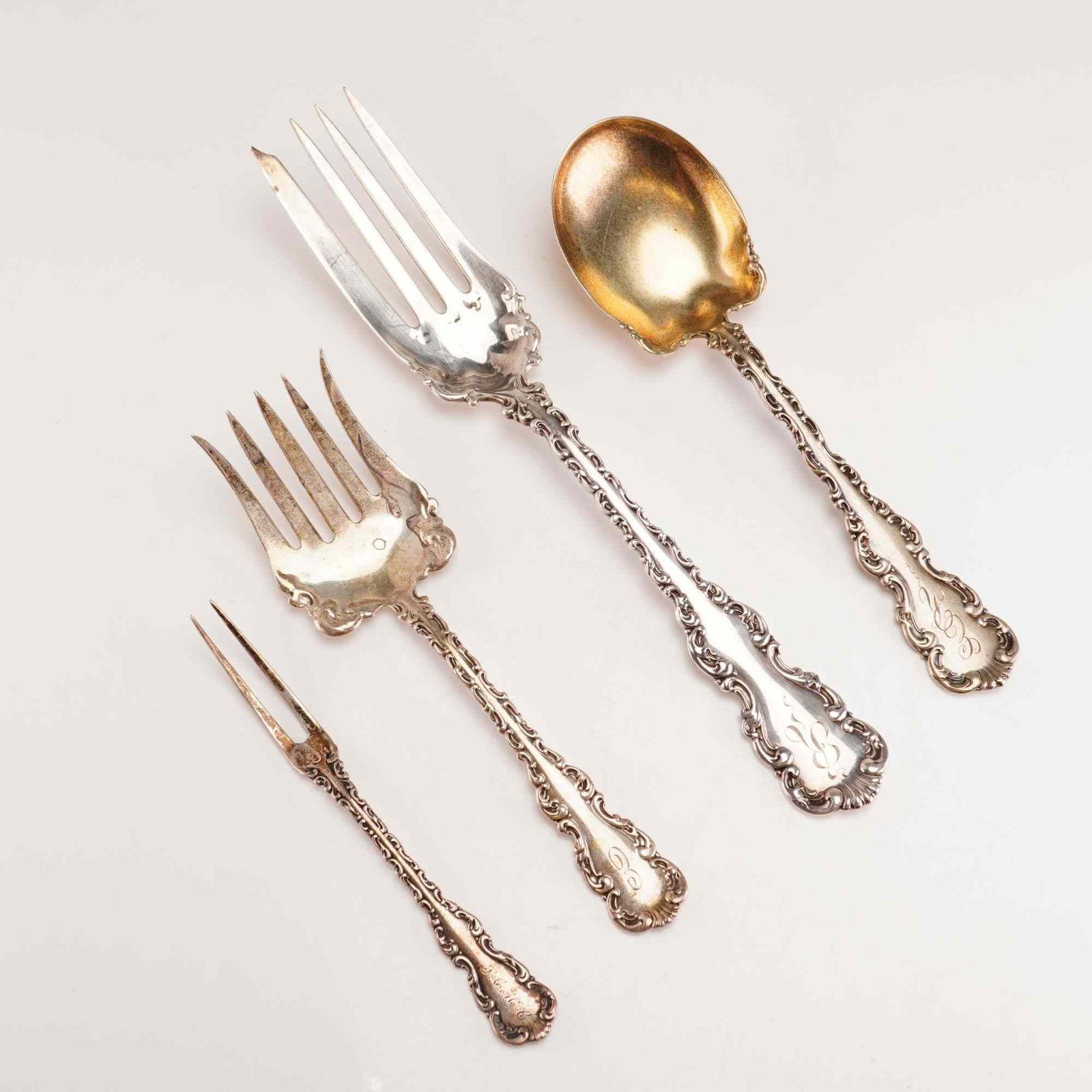 4pc Whiting Manufacturing Company Sterling Silver Serving Pieces: This set of four sterling silver serving pieces was produced by the Whiting Manufacturing Company in the Louis XV pattern, which was patented in 1891. The collection includes a large cold meat fork wi