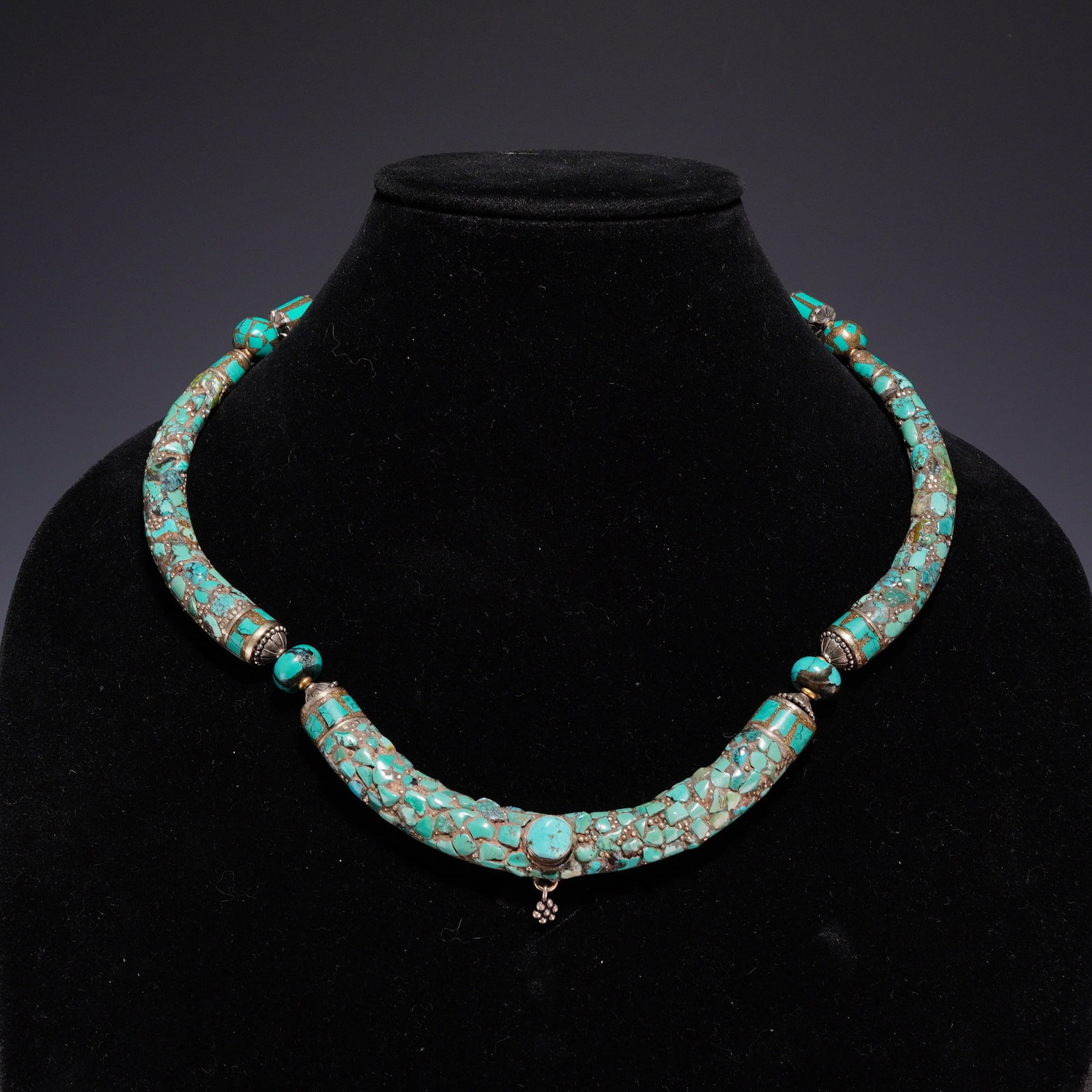 Costume Jewelry Necklace with Fragmented Turquoise Accents: A handcrafted segmented collar necklace featuring three curved tubular sections decorated with a mosaic of fragmented turquoise chip inlay. The central tubular segment is accented by a bezel-set