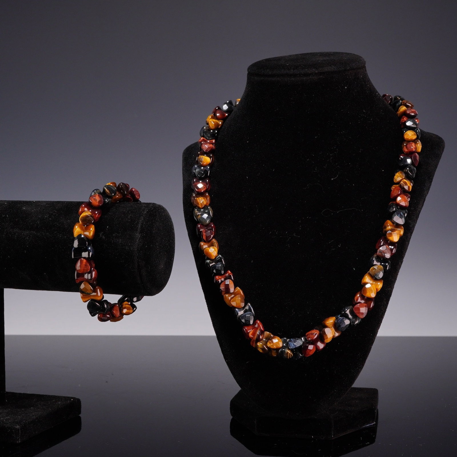 2pc Costume Jewelry Set, Multi-Color Tiger's Eye Beaded Necklace and Bracelet: A two piece costume jewelry set consisting of a beaded necklace and a coordinating bracelet. The items feature faceted, tumbled beads of multi-colored chatoyant tiger's eye in earth tone colors