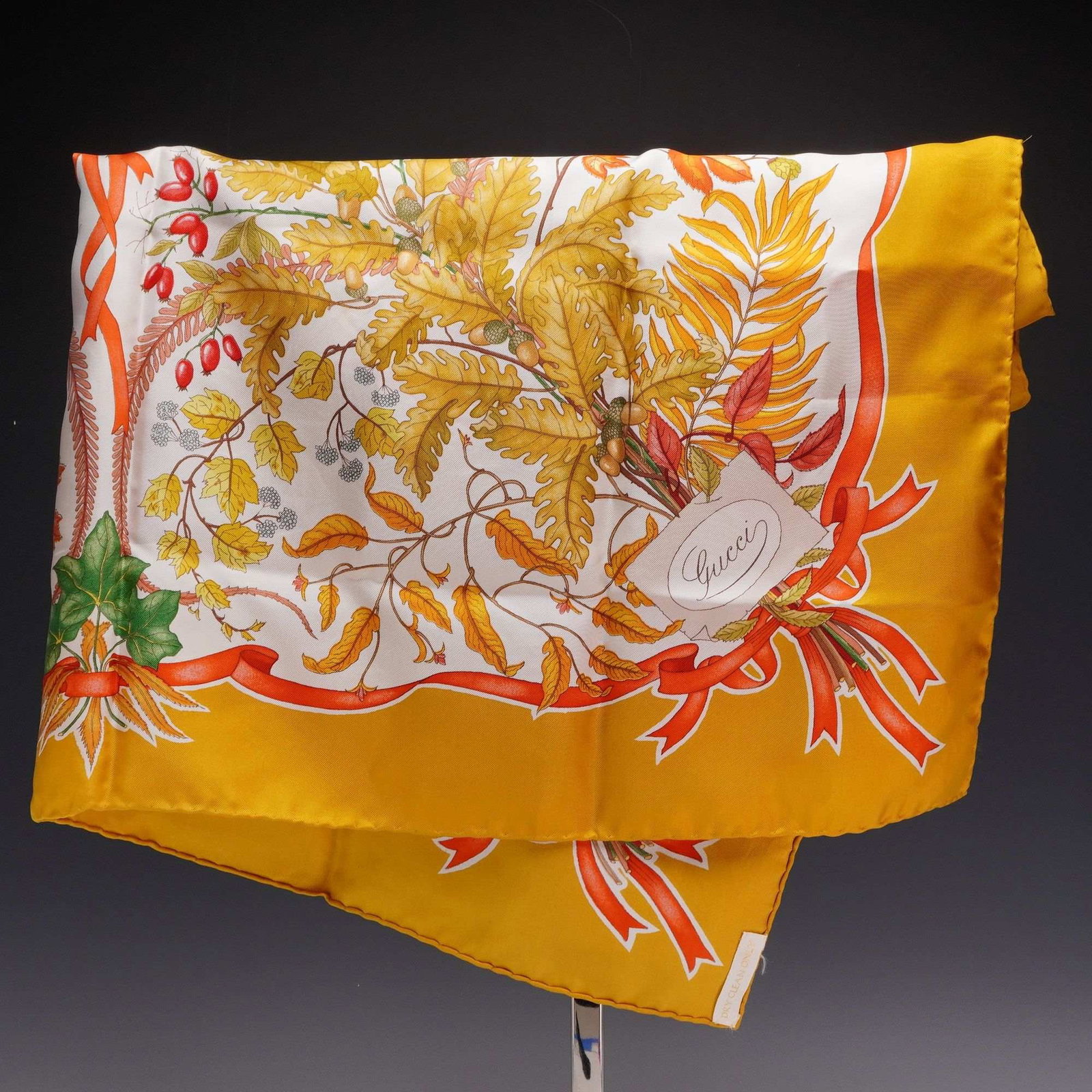Gucci V. Accornero Silk Scarf with Flower and Leaf Design: This Gucci silk twill scarf features a botanical design by Vittorio Accornero. The central composition is set against a white field and depicts an arrangement of oak leaves, acorns, holly branches wit