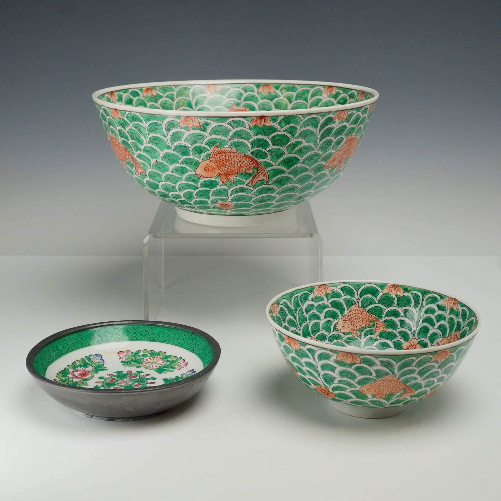 Three Chinese and Japanese Porcelain Items Decorated in Hong Kong for ACF: This grouping consists of three pieces of porcelain decorated in Hong Kong during the mid-20th century for the American Commercial Foundation (ACF). The set includes one large bowl, one small bowl, an