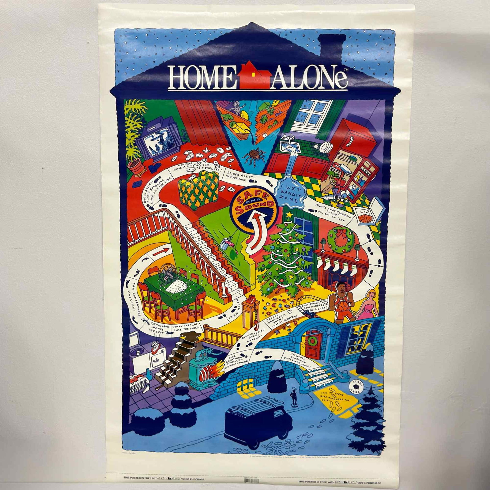 2pc Home Alone Memorabilia Items Including 1991 Promo Trap Map Poster and Original Motion Picture: This lot comprises two items of movie memorabilia related to the 1990 film Home Alone. The largest piece is a vintage 1991 Home Alone promotional video movie poster featuring Kevin McCallister's