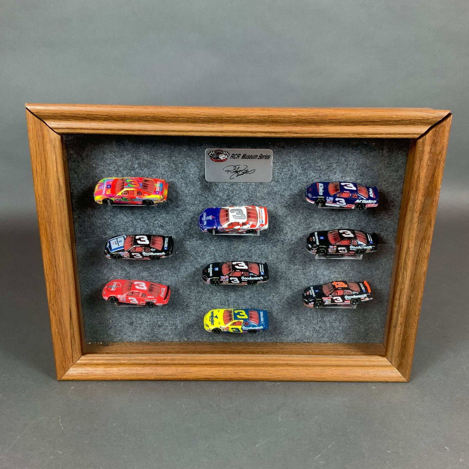 Action Dale Earnhardt RCR Museum Series One NASCAR Set w/ Oak Box: This is a complete Action Collectables RCR Museum Series One 1:64 scale nine-car die-cast set featuring NASCAR driver Dale Earnhardt. The collection is housed in an oak wood shadow box display case wi