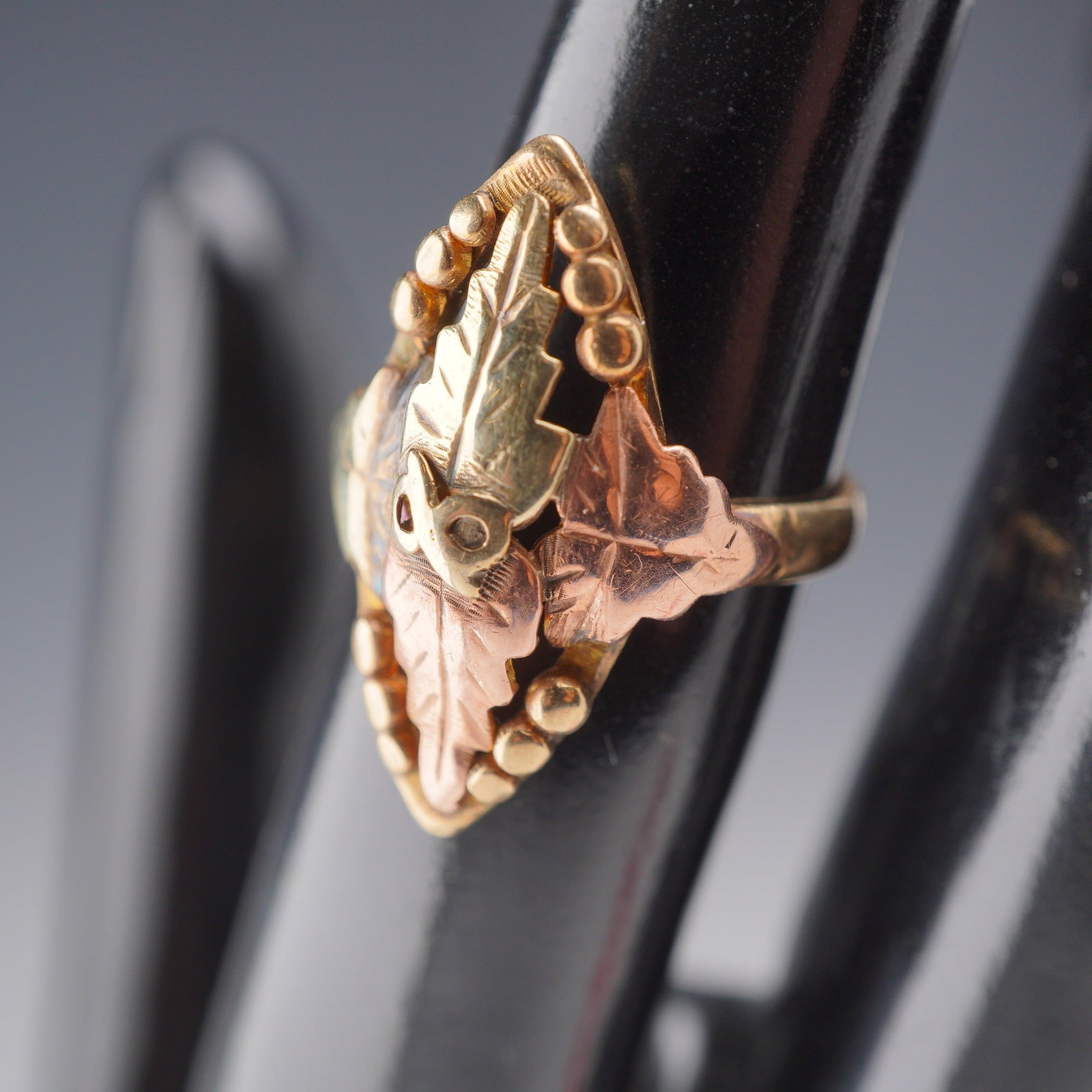 Black Hills Gold Jewelry Multi-Tone 10K-12K Gold Leaf Ring: A vintage tri-color gold ring from the Black Hills Gold Jewelry Co. featuring the distinctive multi-tone styling of the South Dakota region. The jewelry piece is crafted with 10K and 12K gold componen