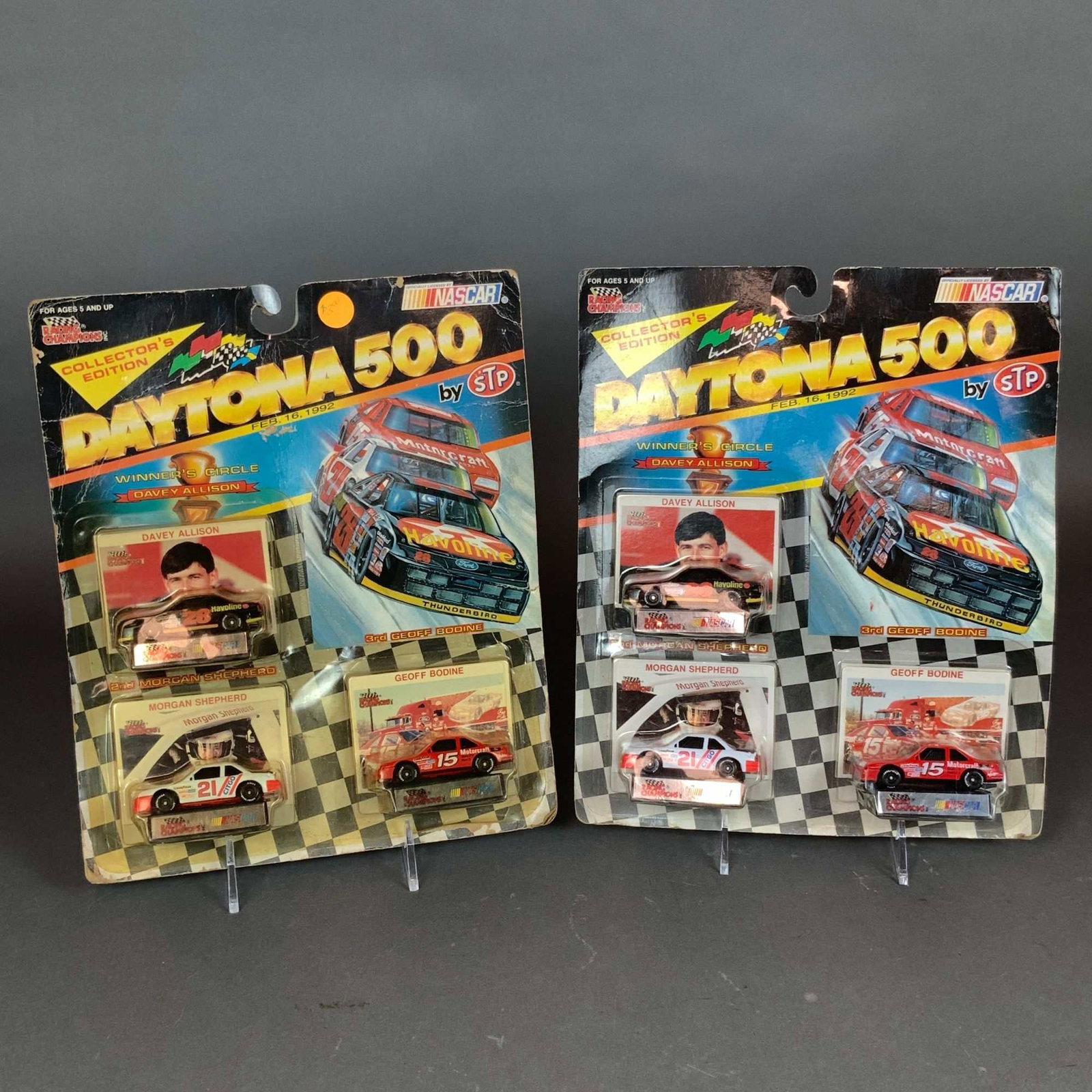 2pc Racing Champions NASCAR Daytona 500 1:64 Scale Model Car 3-Pack Sets: This lot consists of two factory-sealed Racing Champions NASCAR Daytona 500 by STP three-car die-cast model car sets, commemorating the race held on February 16, 1992. Each collector edition set featu