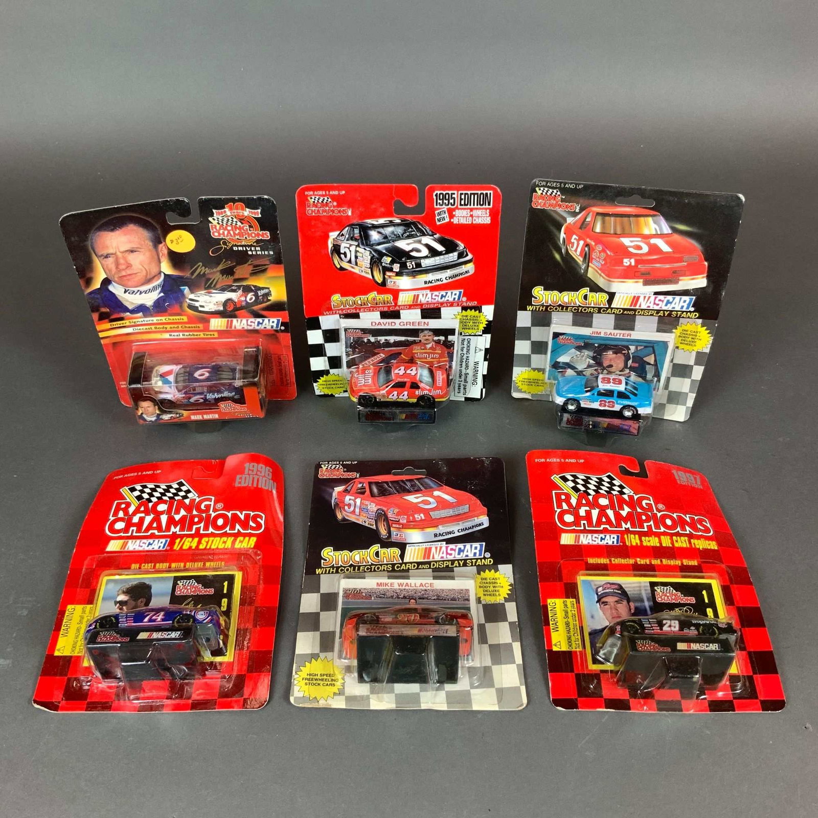 6pc Nascar collectible car models by Racing Champions: A collection of six Racing Champions NASCAR die-cast stock car models in 1/64 scale. This variety lot features vehicles from the mid-to-late 1990s, including 1995, 1996, and 1997 editions. Each model 