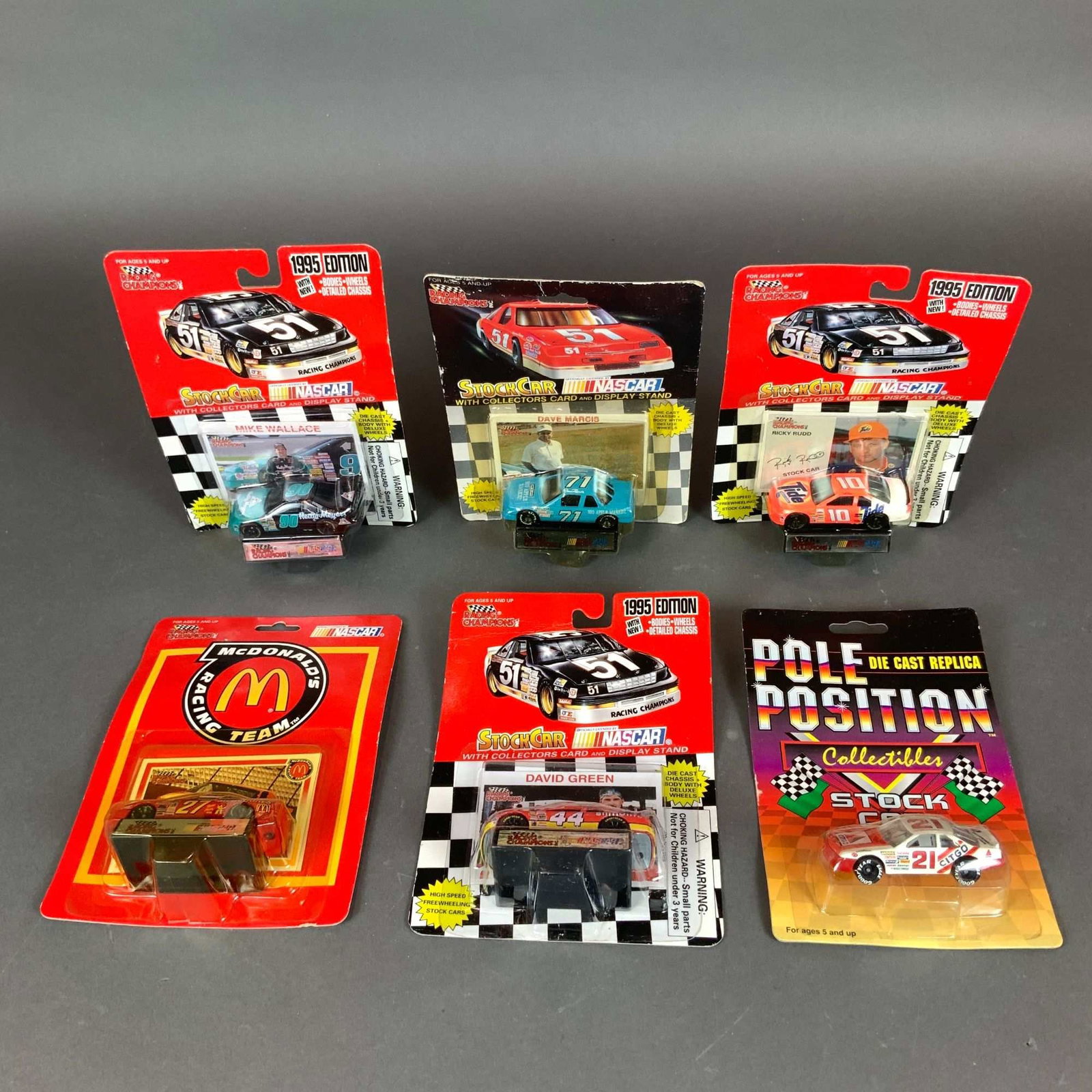 6pc Racing Champions & Pole Position NASCAR Die-Cast Stock Cars: This lot features a 6pc collection of collectible racing car models consisting of 1/64 scale NASCAR die-cast stock cars in their original unopened manufacturer packaging. The group contains five vehic