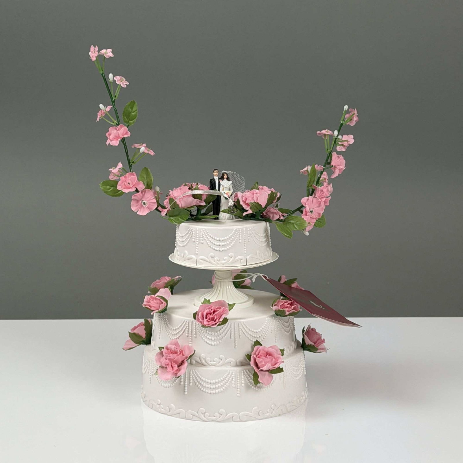 American Girl Samantha's Wedding Cake: This is a miniature three-tier American Girl wedding cake accessory set, part of the Samantha Parkington bridesmaid accessories collection. The set features a molded white plastic cake with decorative