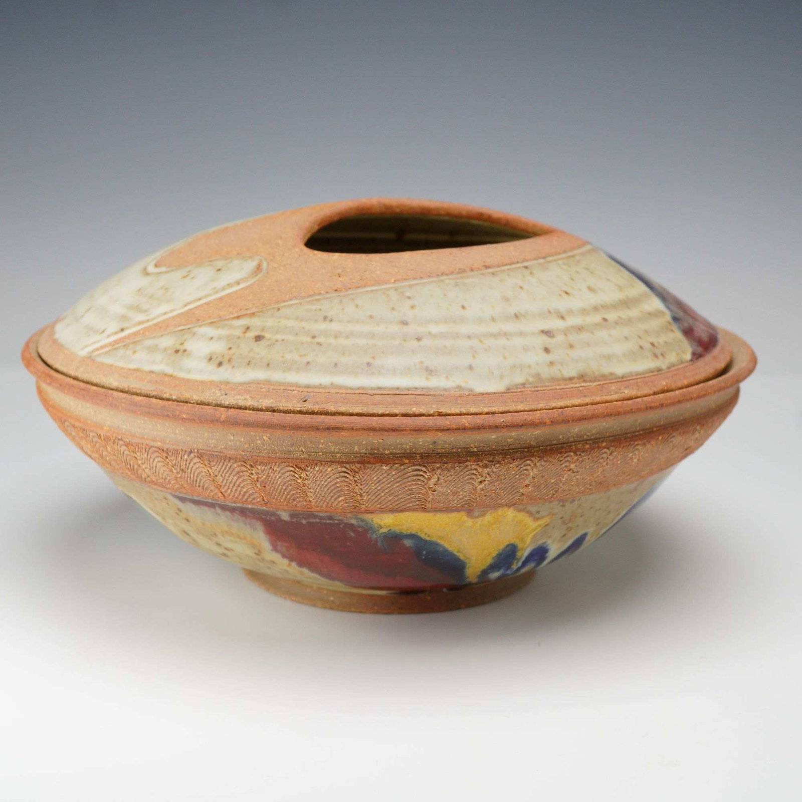 Signed Ken Pick Studio Art Pottery Lidded Serving Bowl: This lot consists of a hand-made studio stoneware lidded serving bowl by Vermont potter Ken Pick. The piece features a shallow, wheel-thrown footed bowl paired with a matching domed lid that includes 