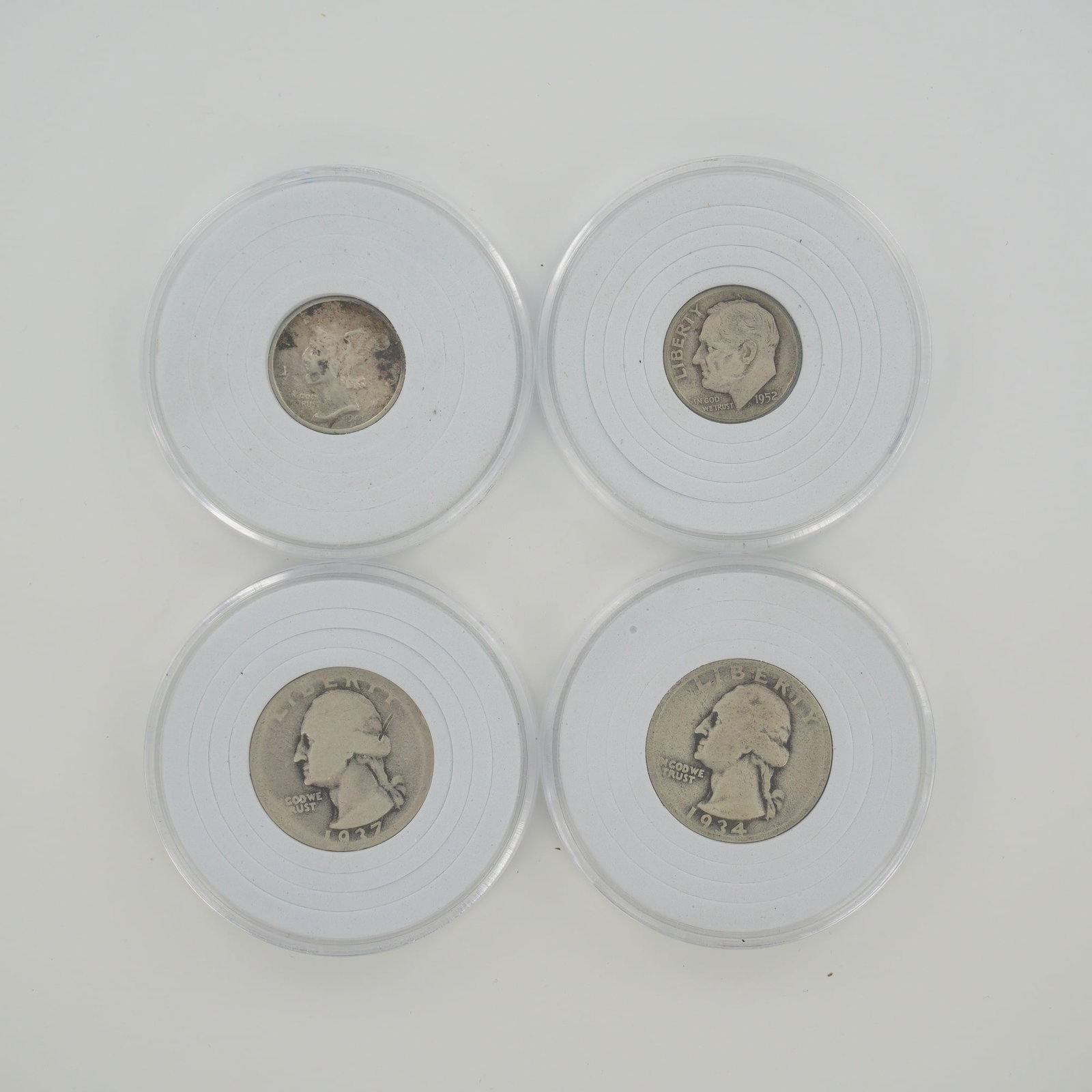 4pc Collection of US 90% Silver Dimes and Quarters: This lot consists of a 4pc collection of US 90% silver coinage. The group includes two Washington quarters and two dimes. One quarter is dated 1934 and the other 1937; both lack mint marks, indicating